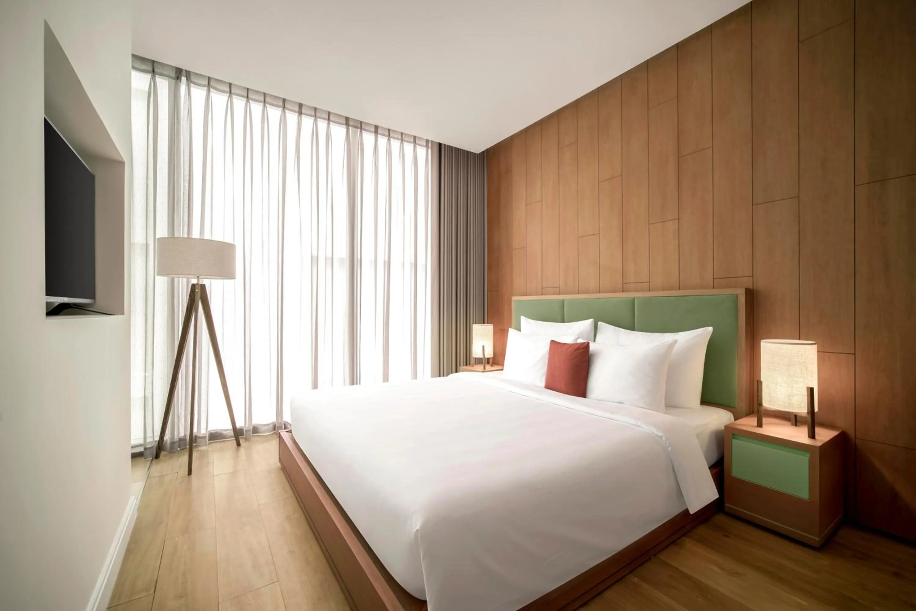 Bed in Signature by M Village Beachfront Hotel