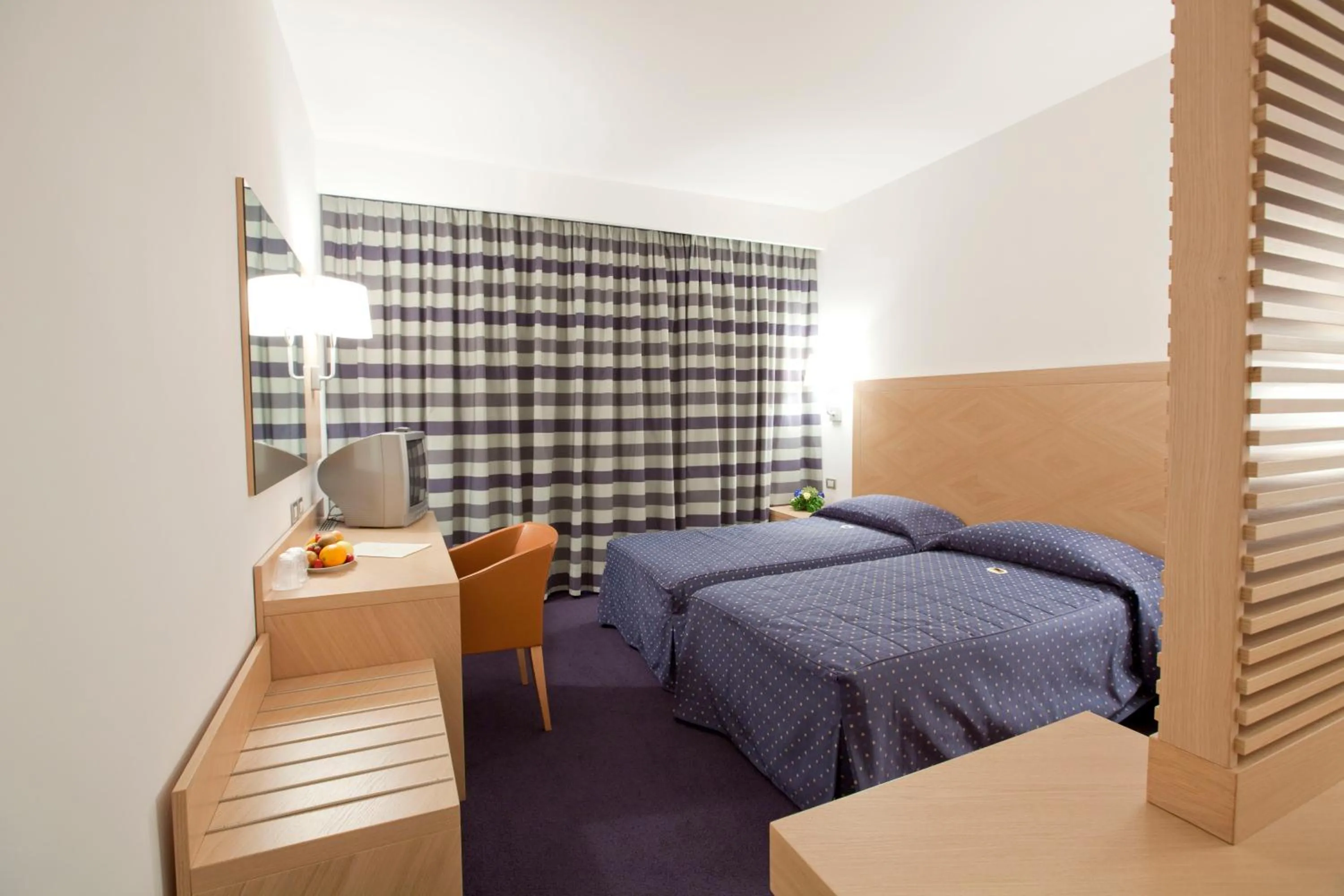 Bed in Centrum Palace Hotel & Resorts