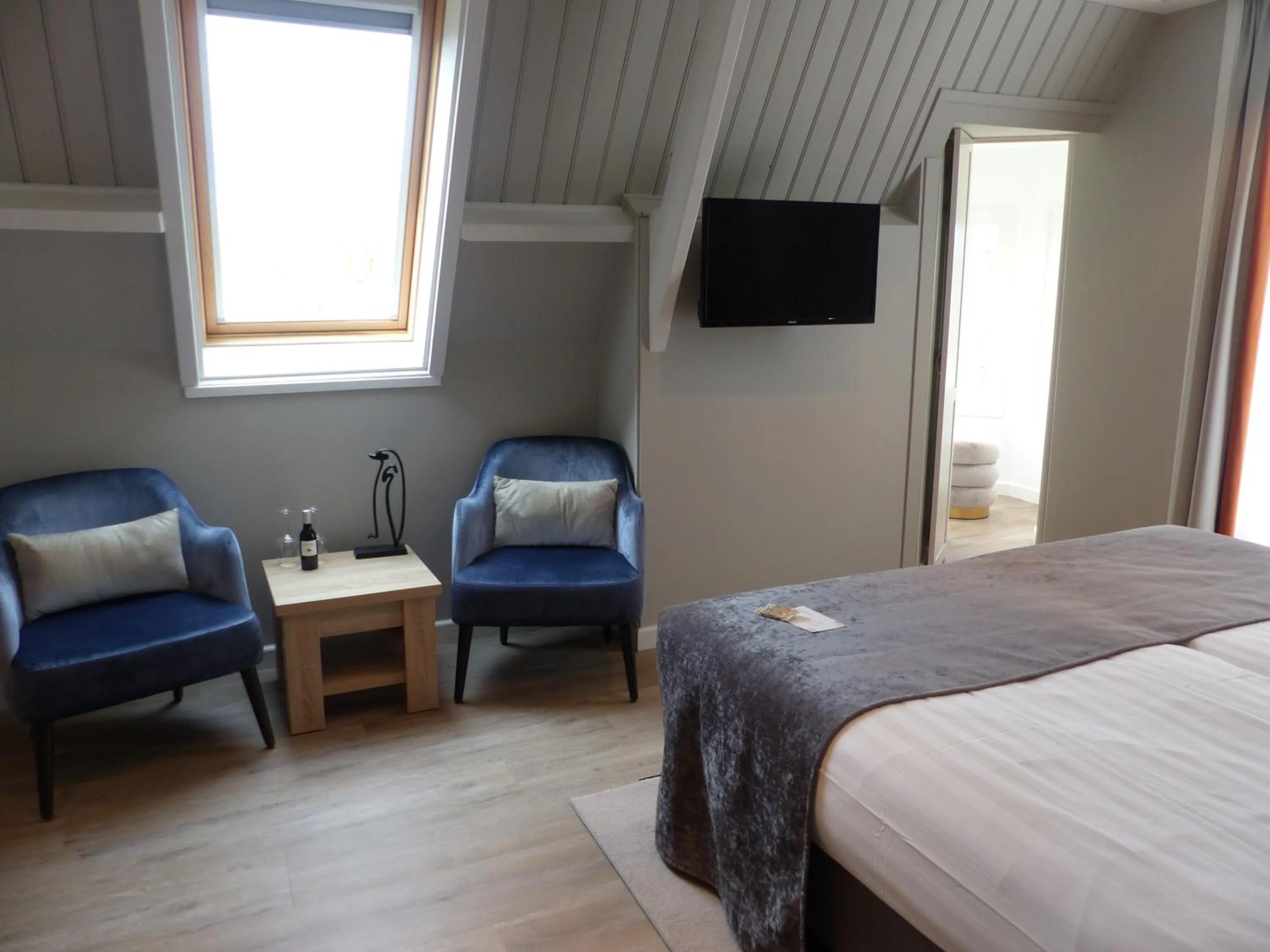 Seating area, Bed in Herberg Welgelegen