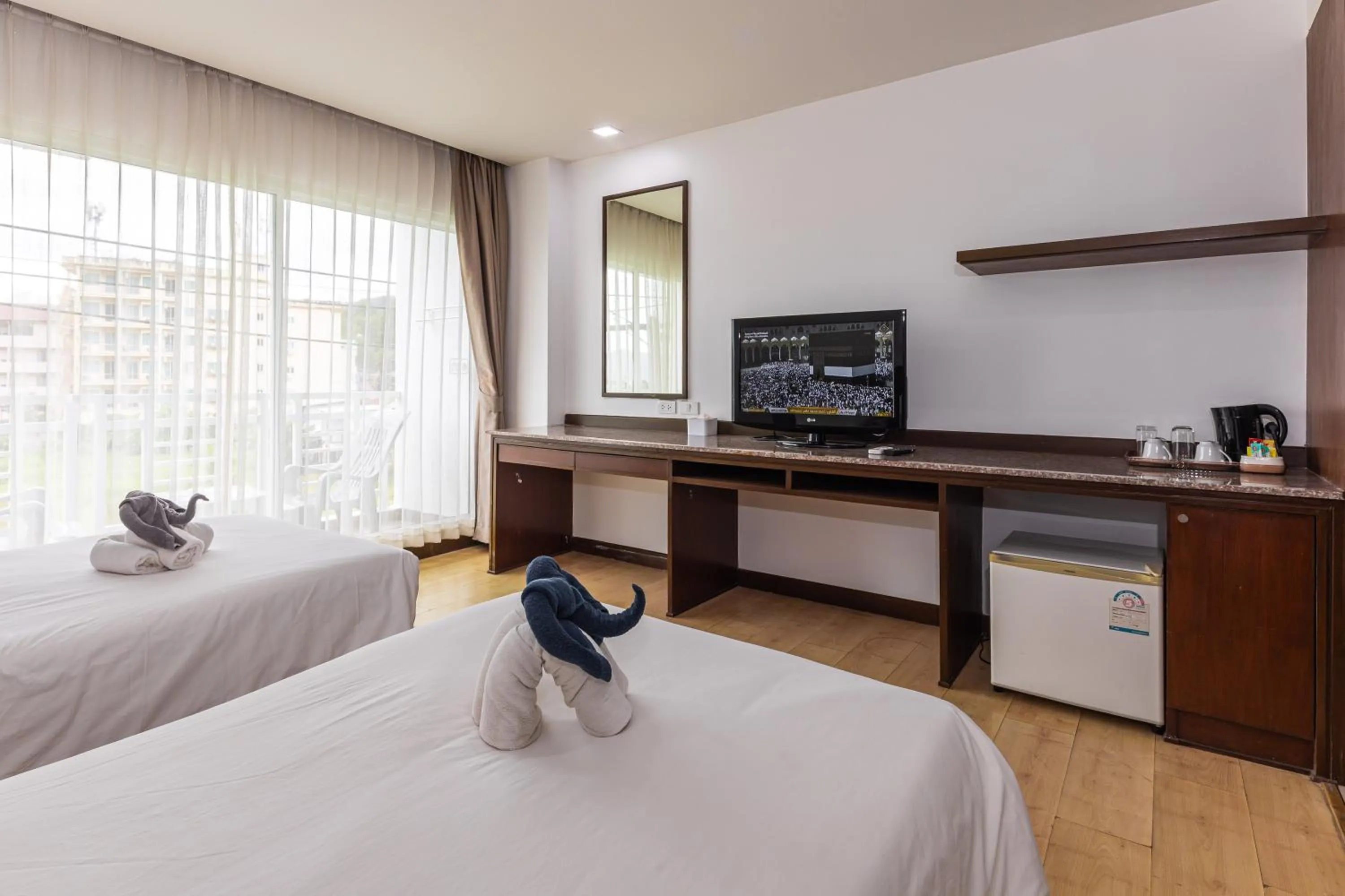 Bed in The Kris Resort Hotel