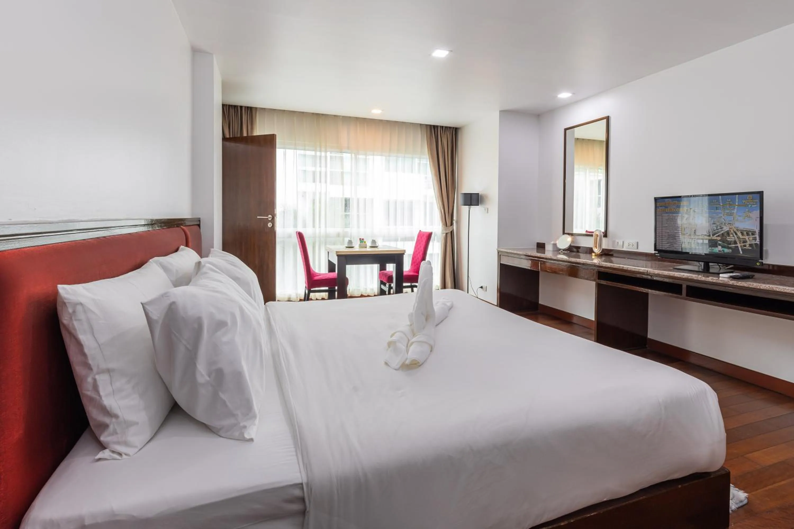 Bed in The Kris Resort Hotel