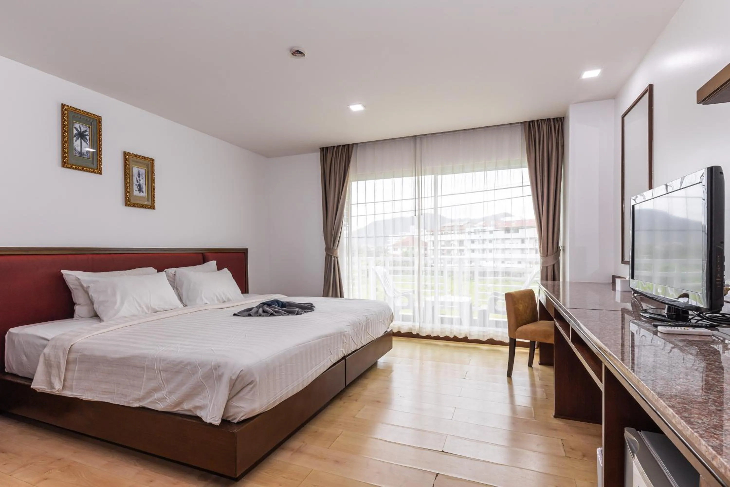 Bed in The Kris Resort Hotel