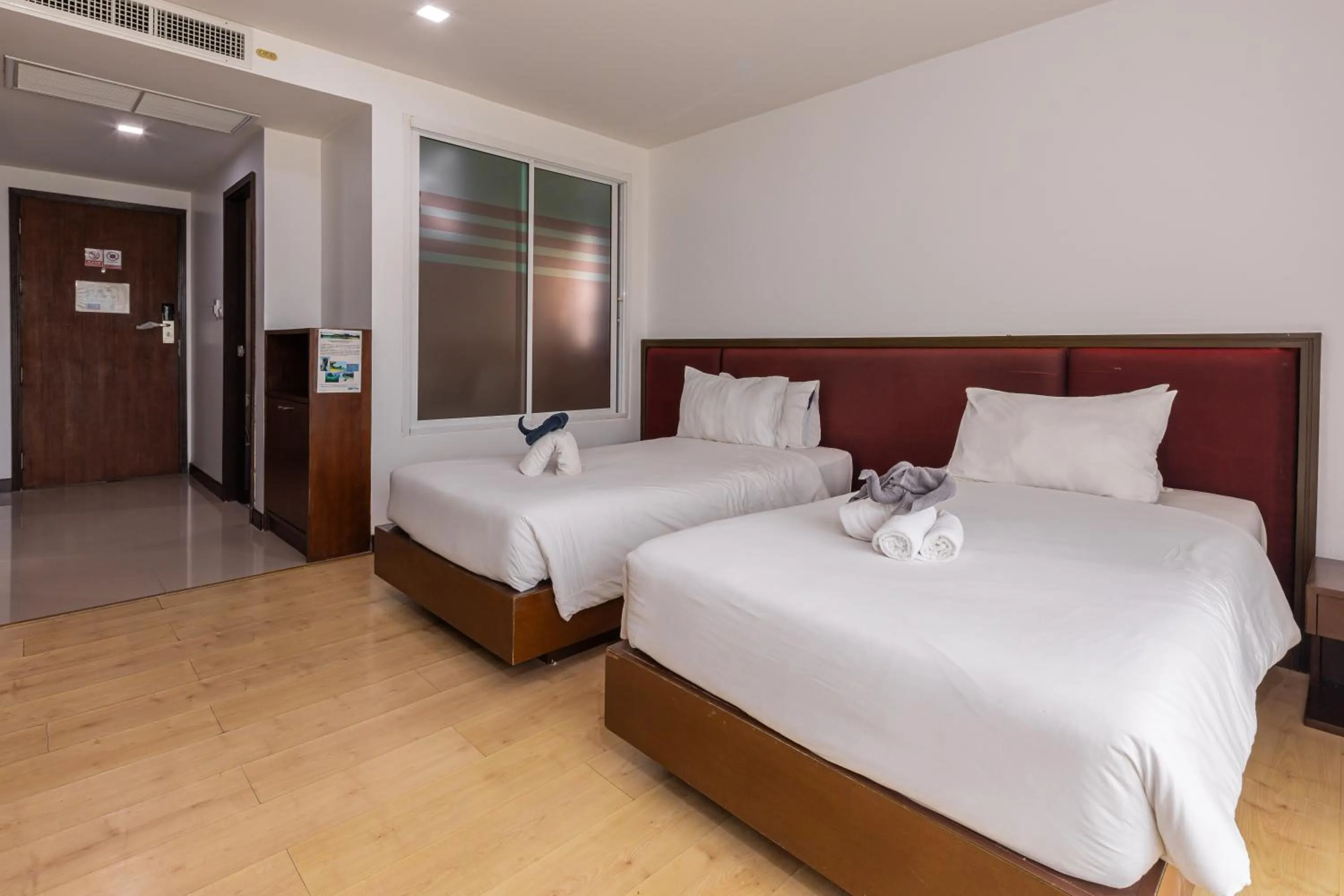 Bed in The Kris Resort Hotel