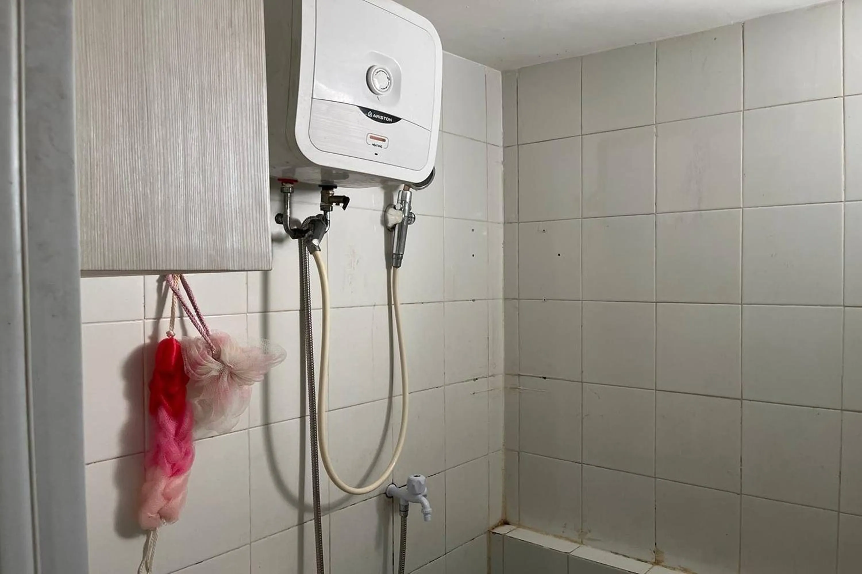 Shower in Apartment Bassura City by Berkah Estate