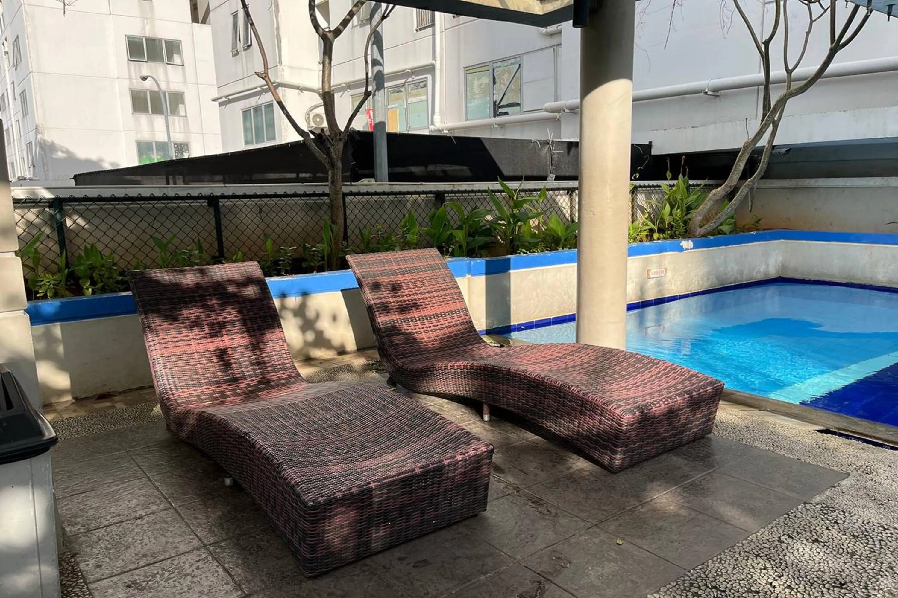 Swimming pool in Apartment Bassura City by Berkah Estate