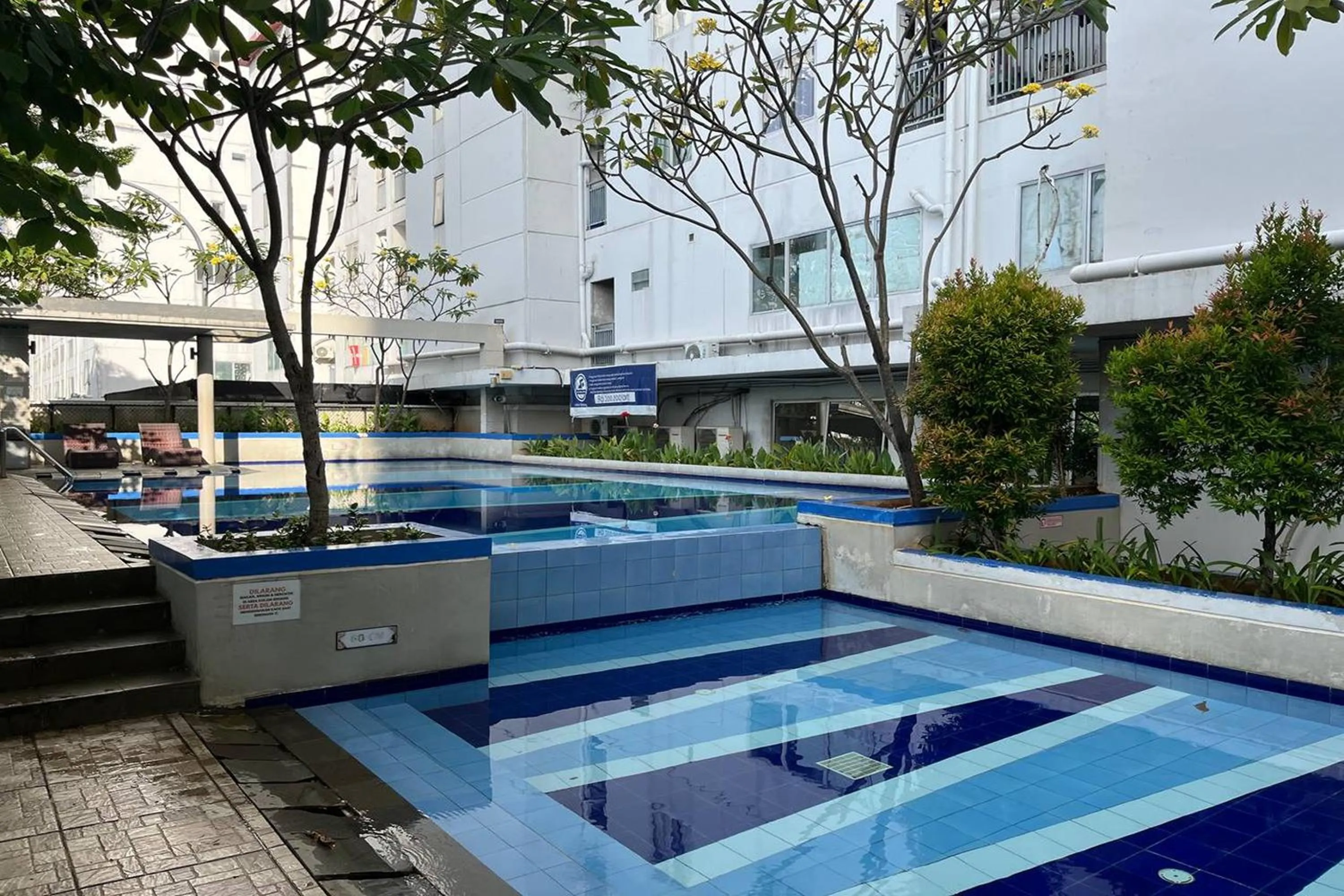 Swimming pool in Apartment Bassura City by Berkah Estate