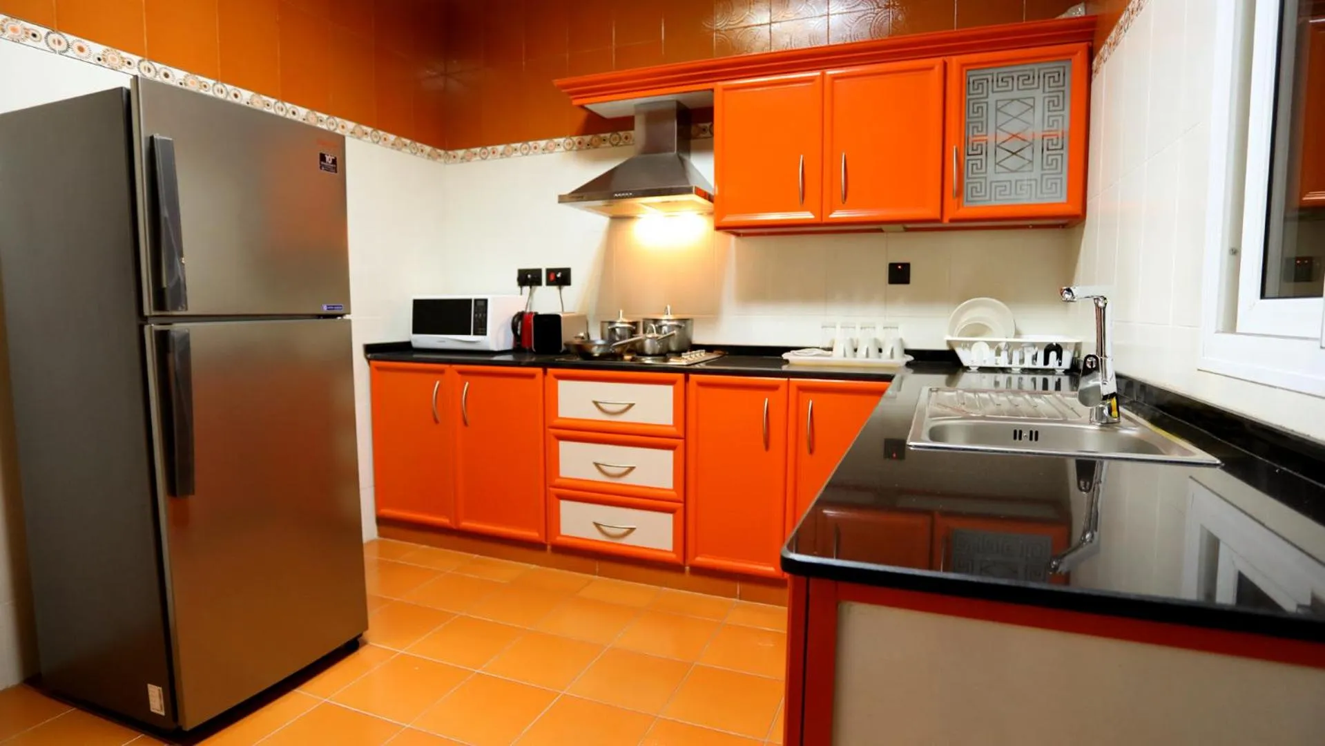 Kitchen or kitchenette in Remas Hotel Suites - Al Khoudh, Seeb, Muscat