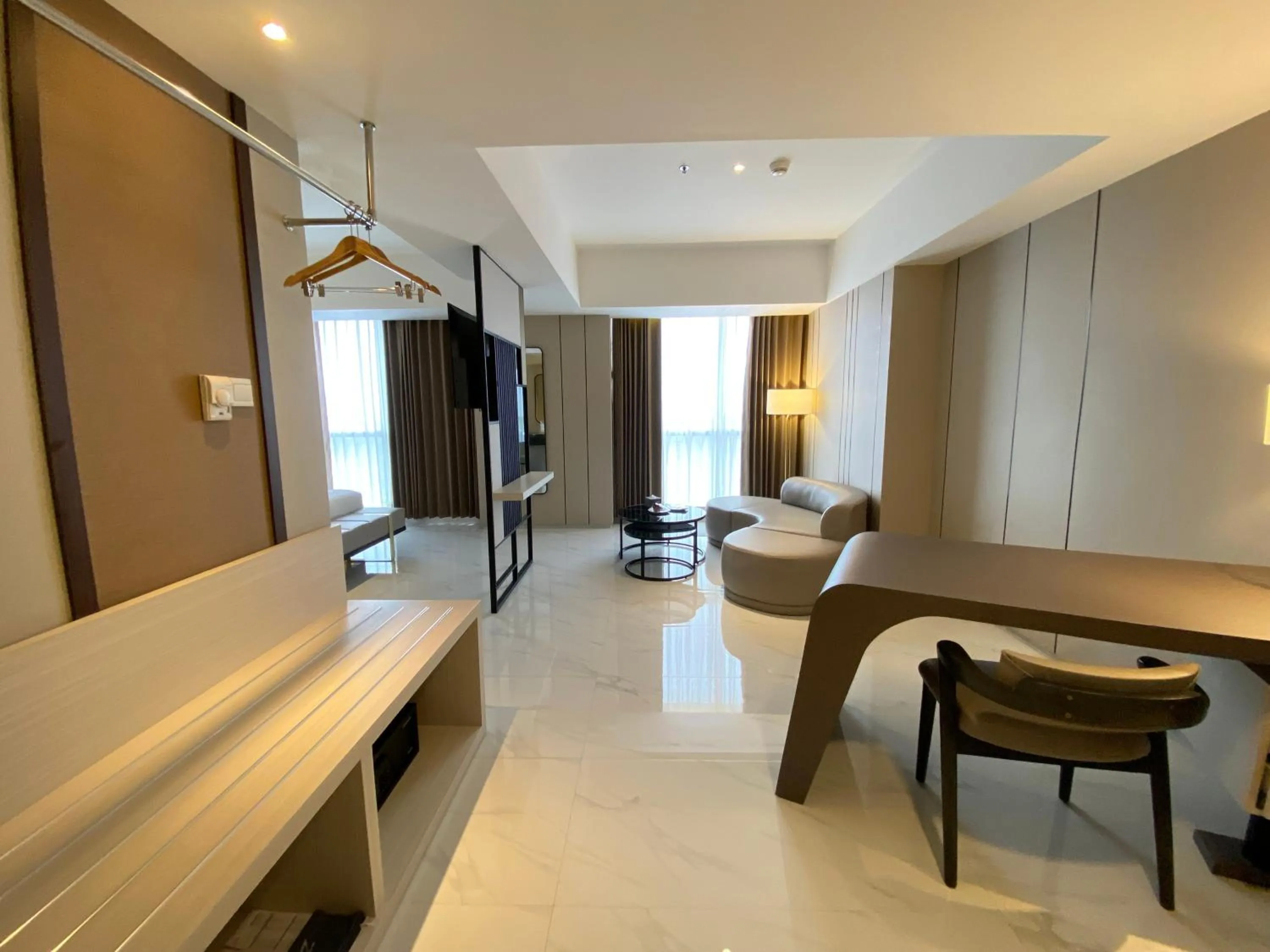 Living room, Bed in Grand Whiz Hotel Praxis Surabaya