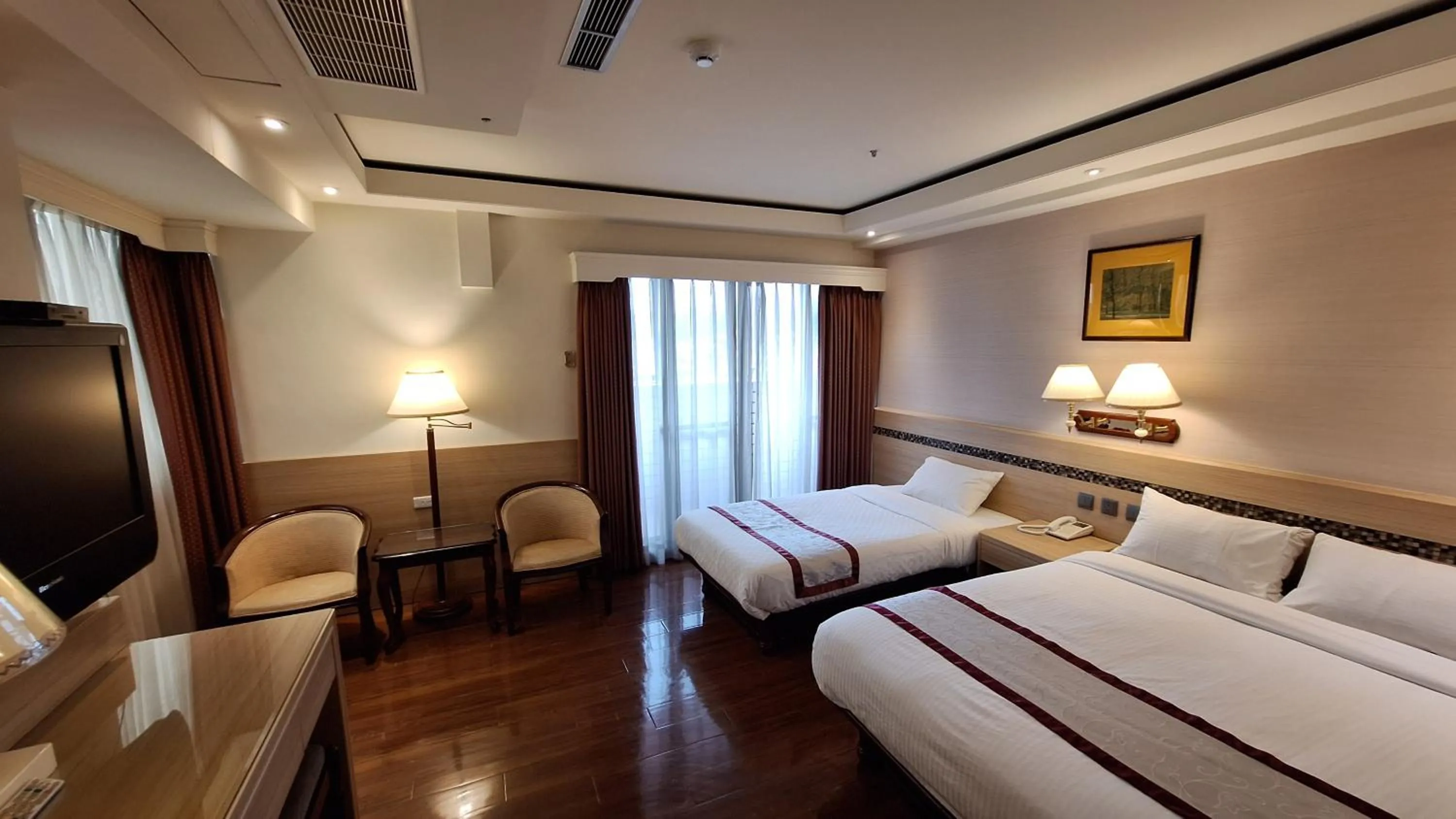 Bed in Cheng Pao Hotel