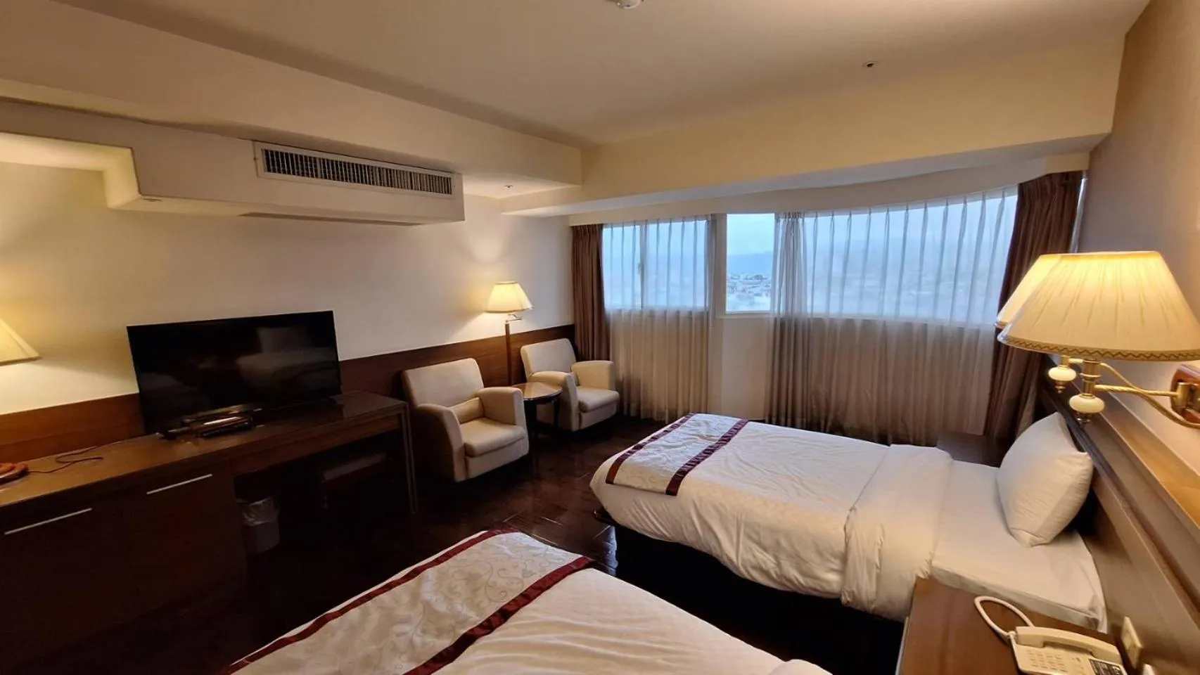 Bed in Cheng Pao Hotel