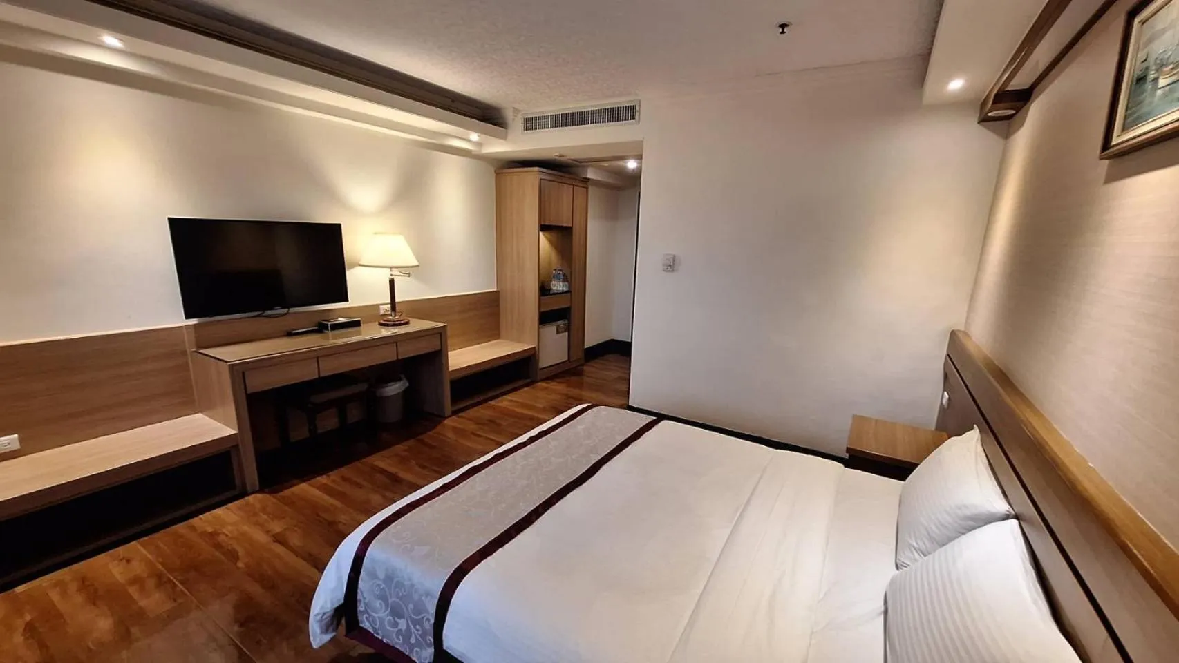 Bed in Cheng Pao Hotel