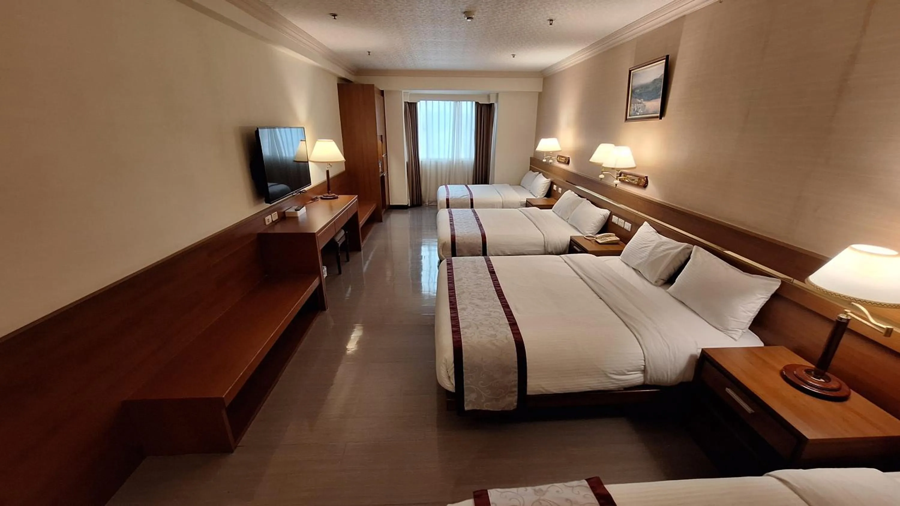 Bed in Cheng Pao Hotel