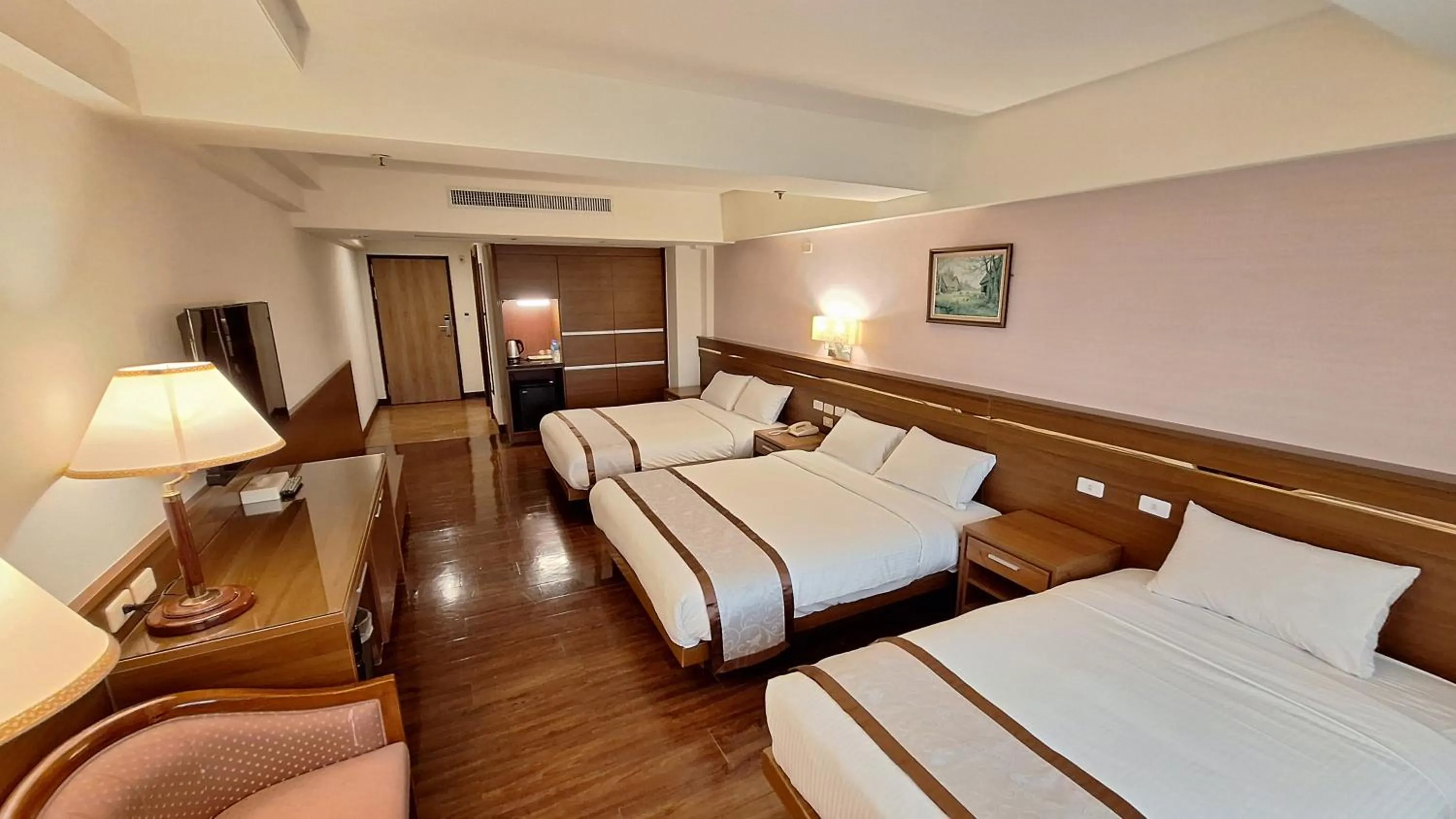 Bed in Cheng Pao Hotel