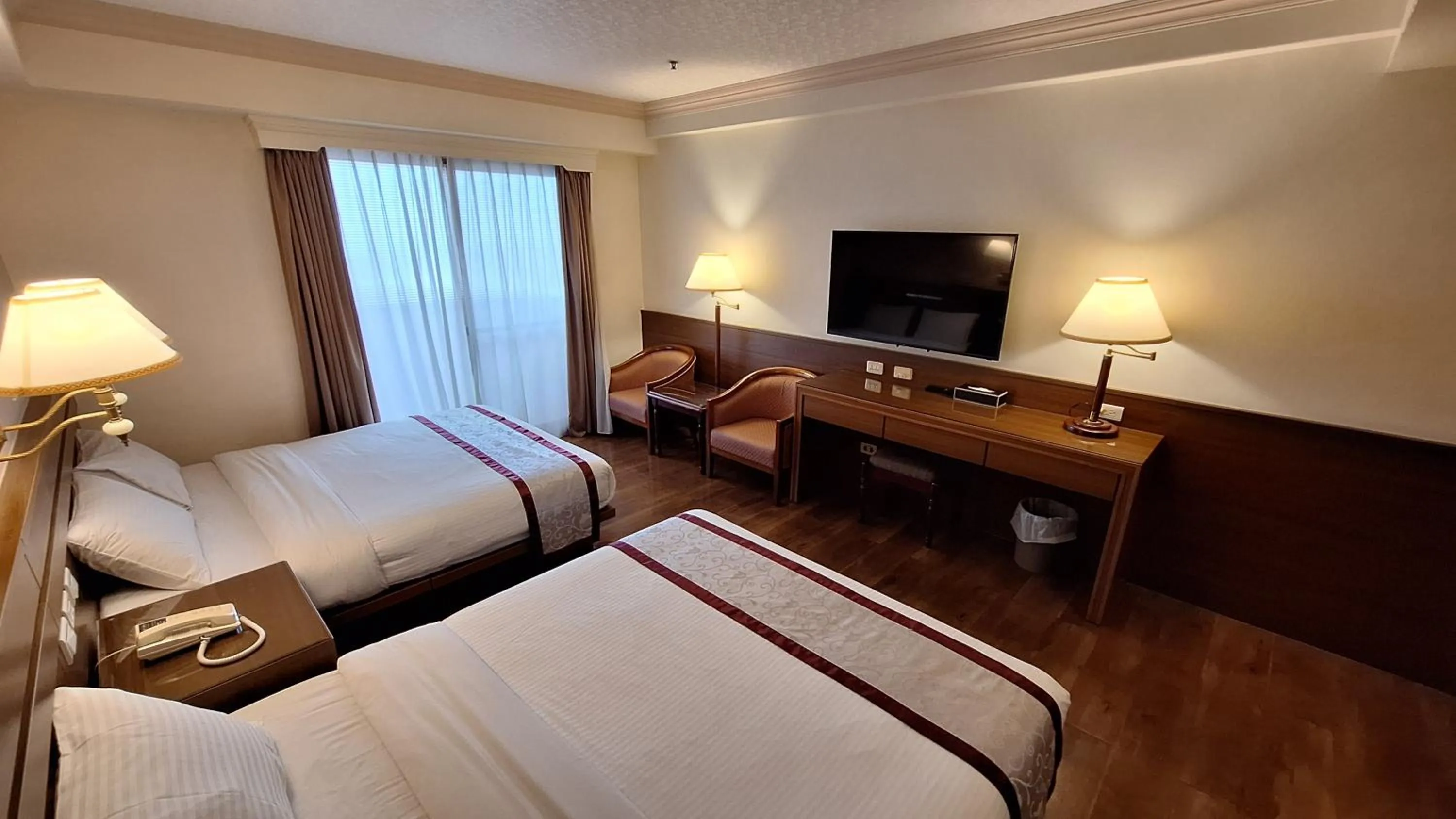 Bed in Cheng Pao Hotel