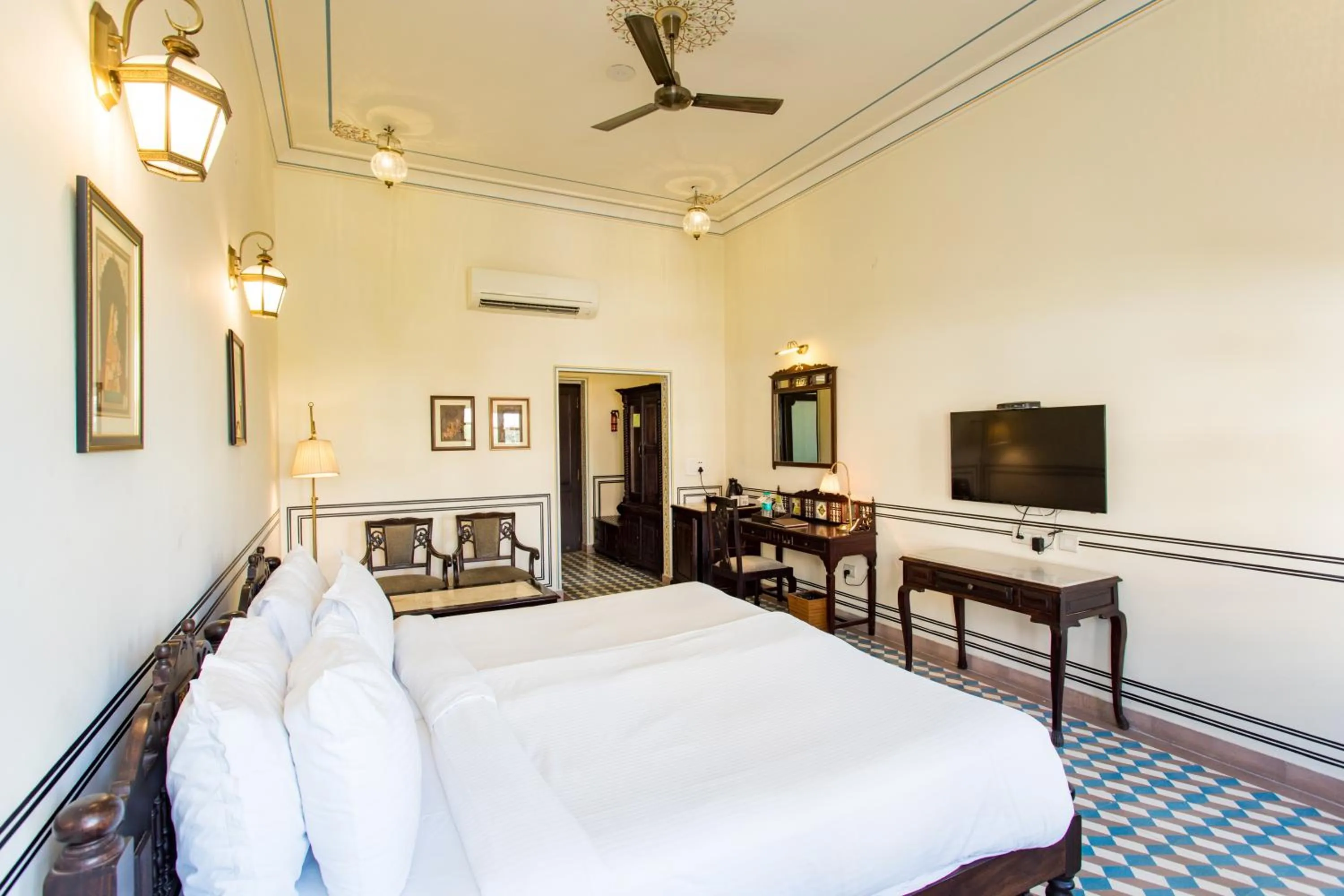 Bed in Grand Uniara A Heritage Hotel