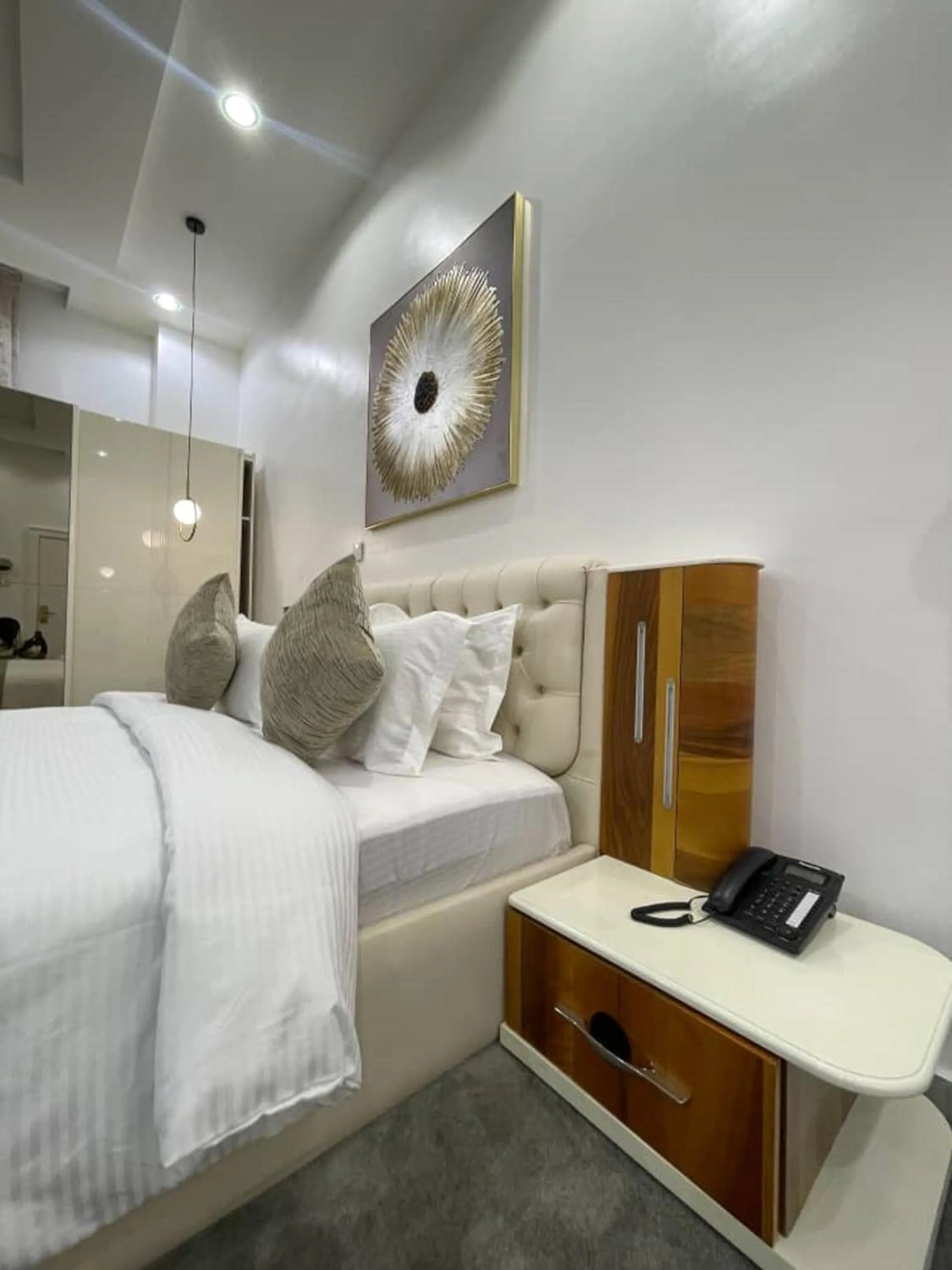 Bed in UrbanEdge Hotel