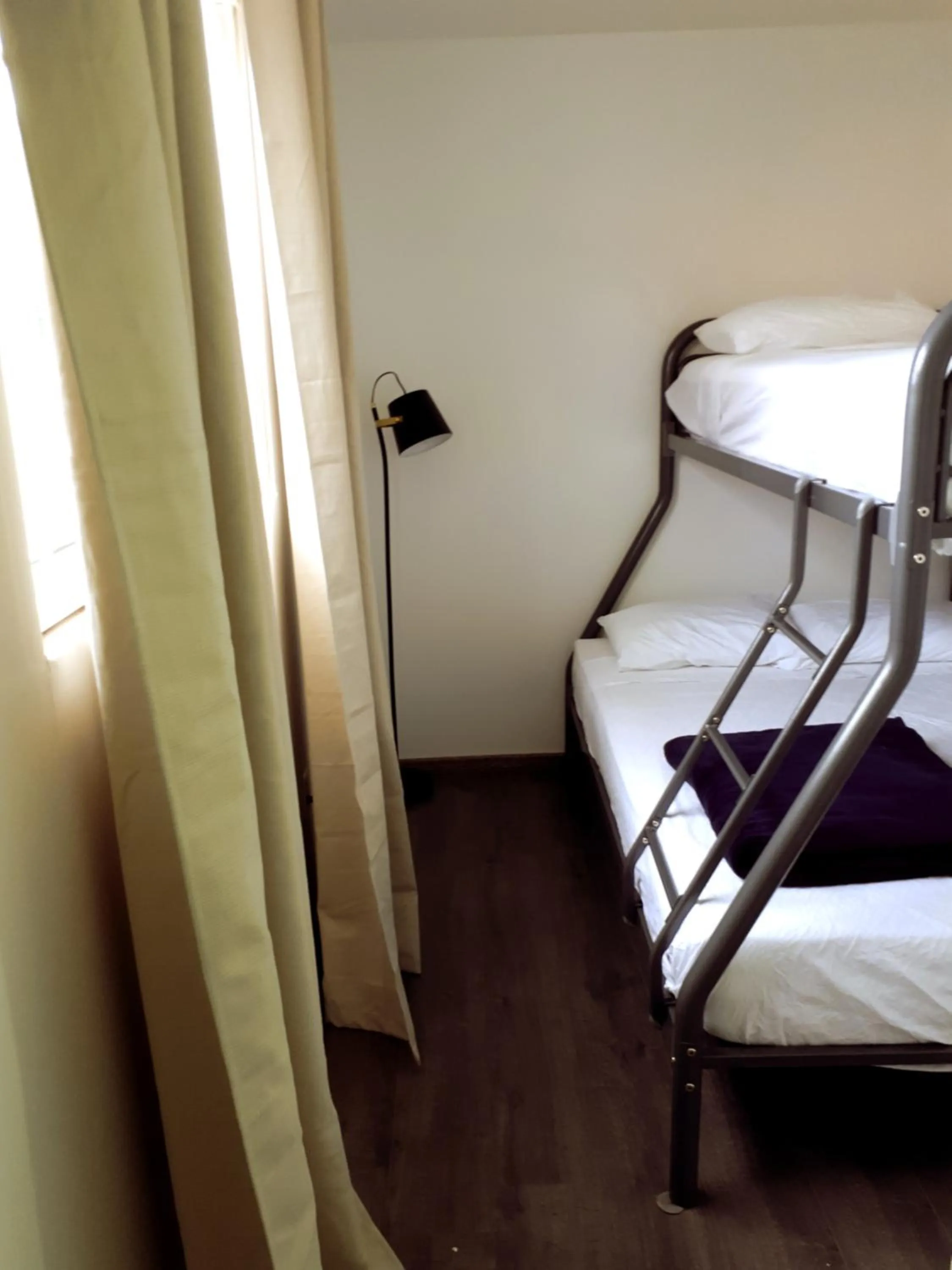 Bed in Palm Trees Apartments