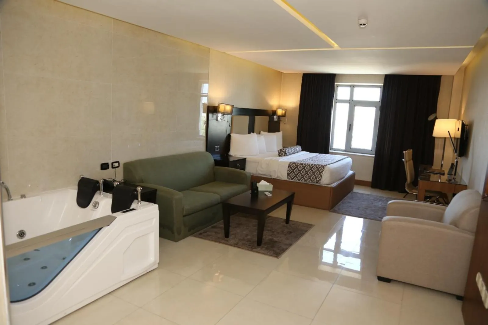 Seating area, Bed in Olive Tree Amman