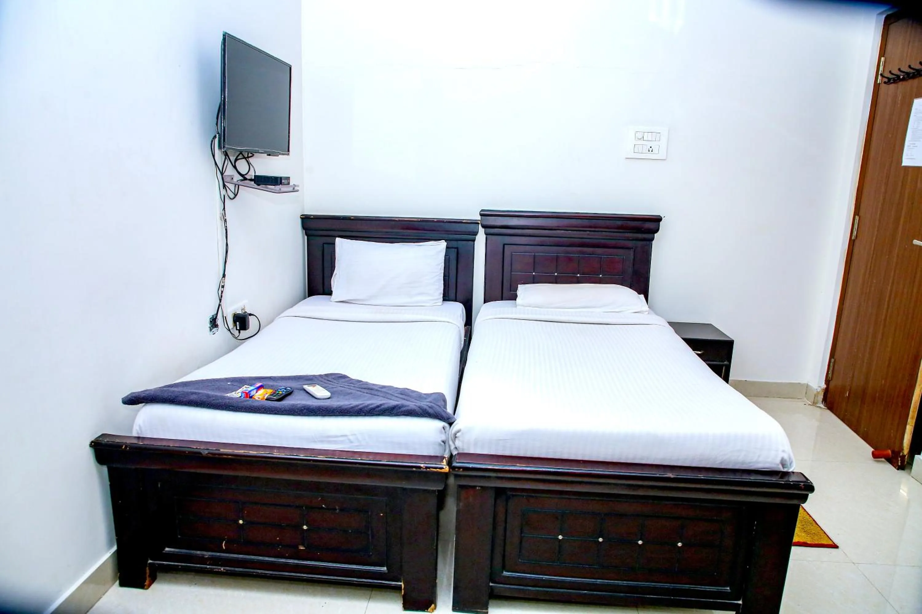 Photo of the whole room, Bed in Sri Ramanjaneya Nilayam