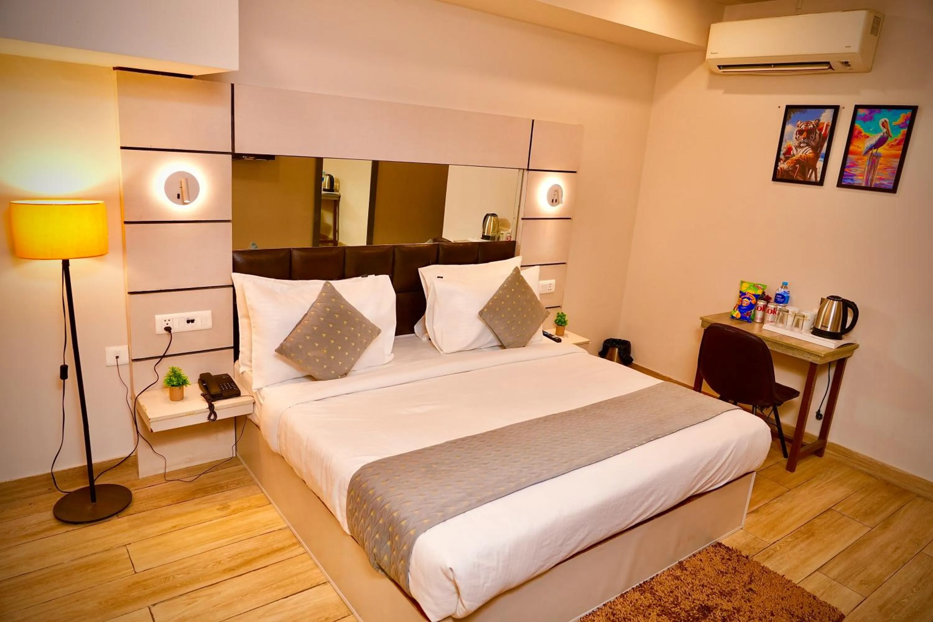 Bed in Hotel Royal Saffron by Majesta Stays