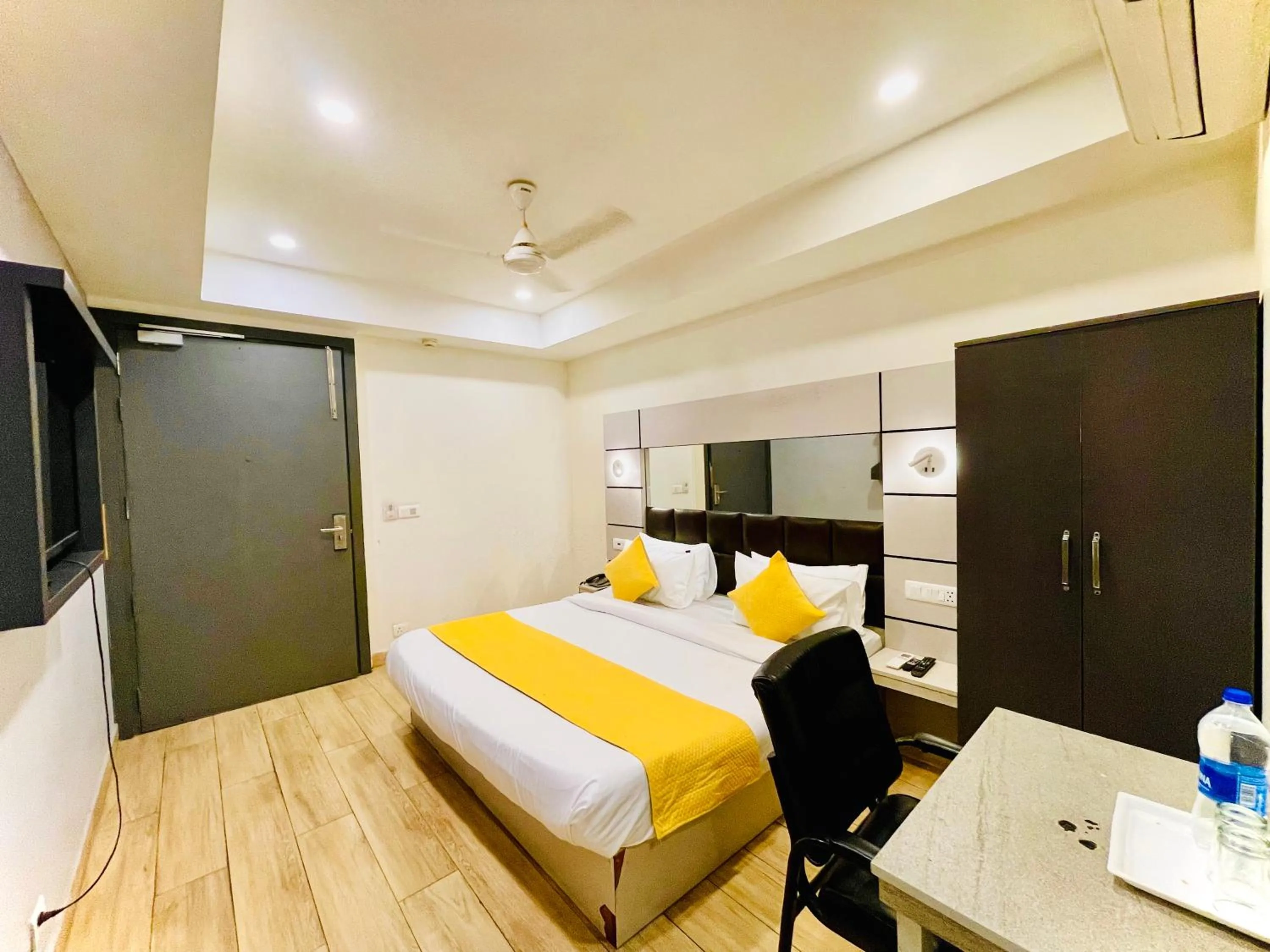Living room, Bed in Hotel Royal Saffron by Majesta Stays