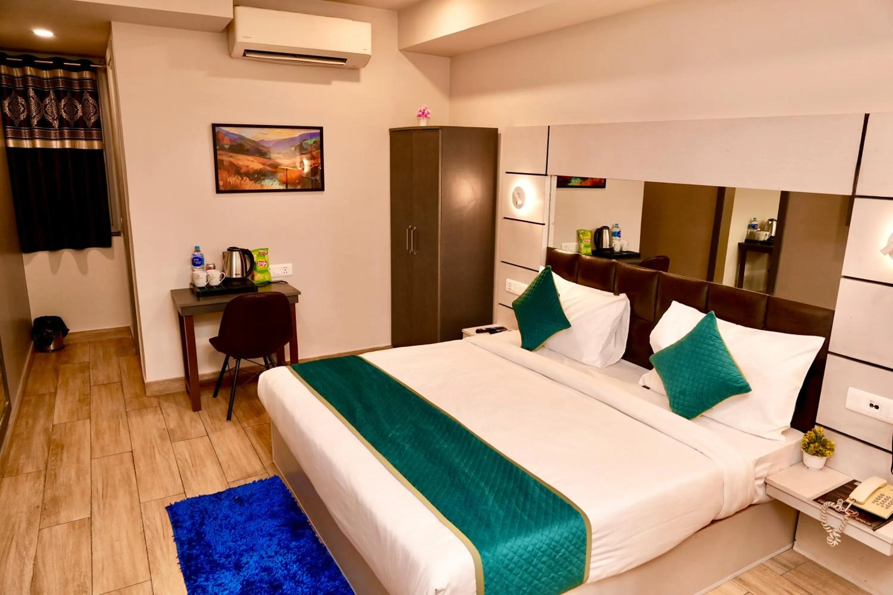 Bed in Hotel Royal Saffron by Majesta Stays