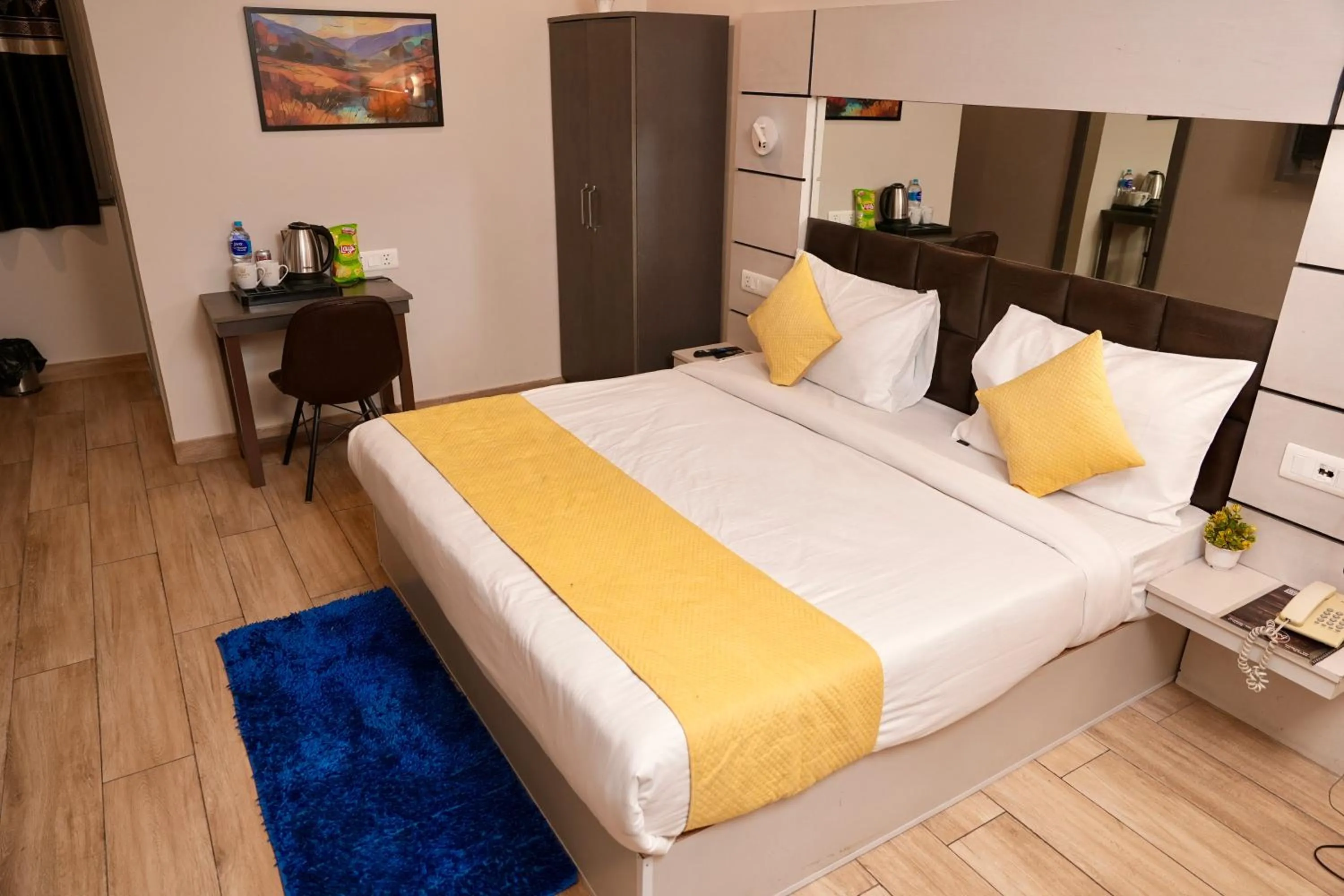 Bed in Hotel Royal Saffron by Majesta Stays