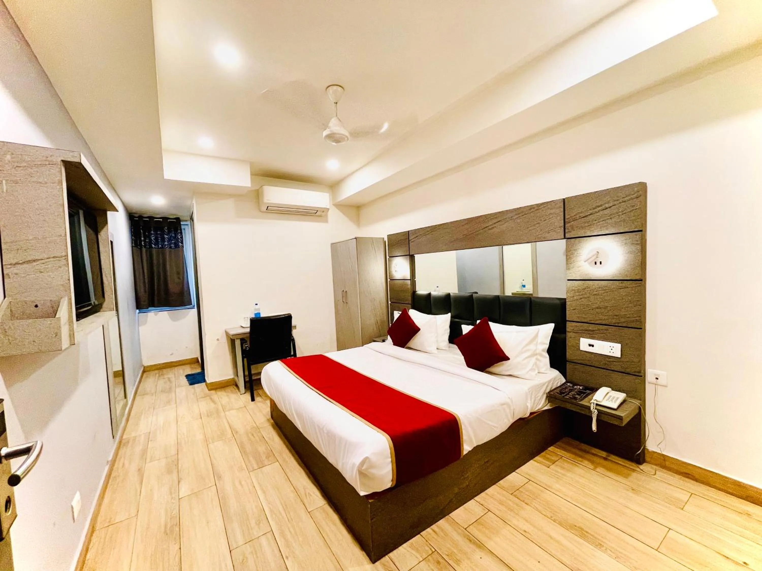 Bed in Hotel Royal Saffron by Majesta Stays