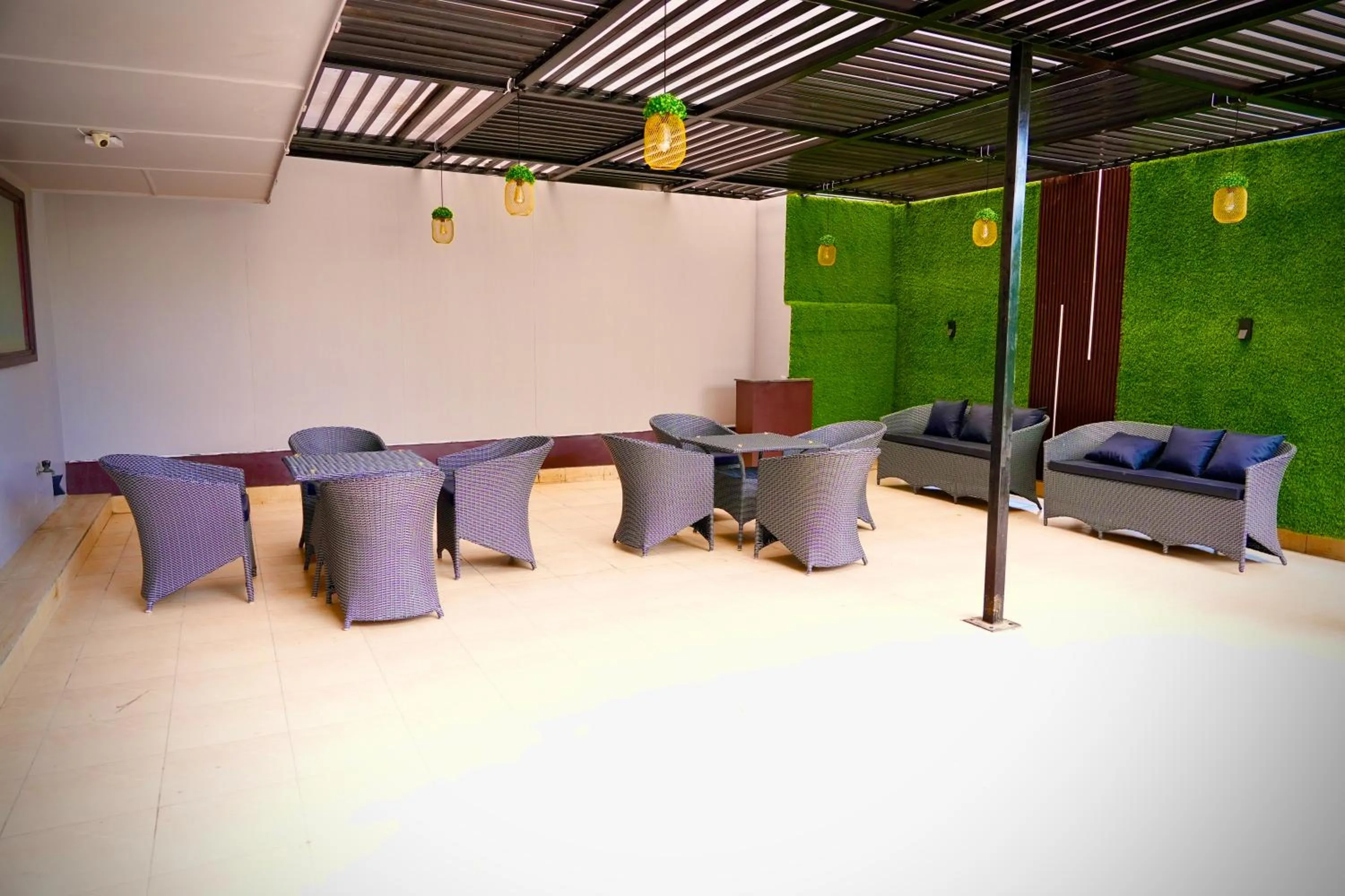 Seating area in Hotel Royal Saffron by Majesta Stays