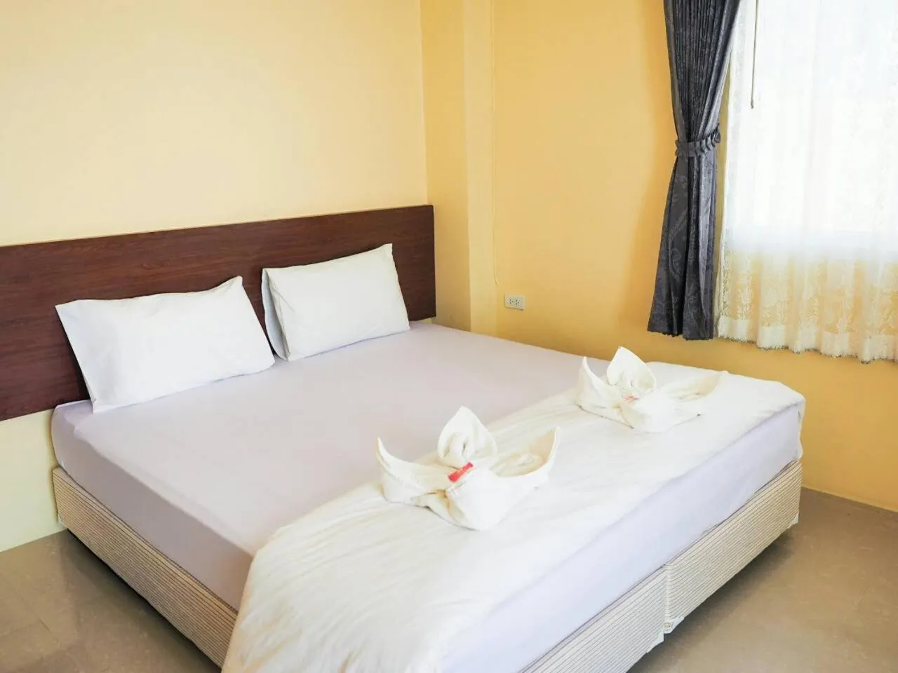 Bed in Wansiri Mansion