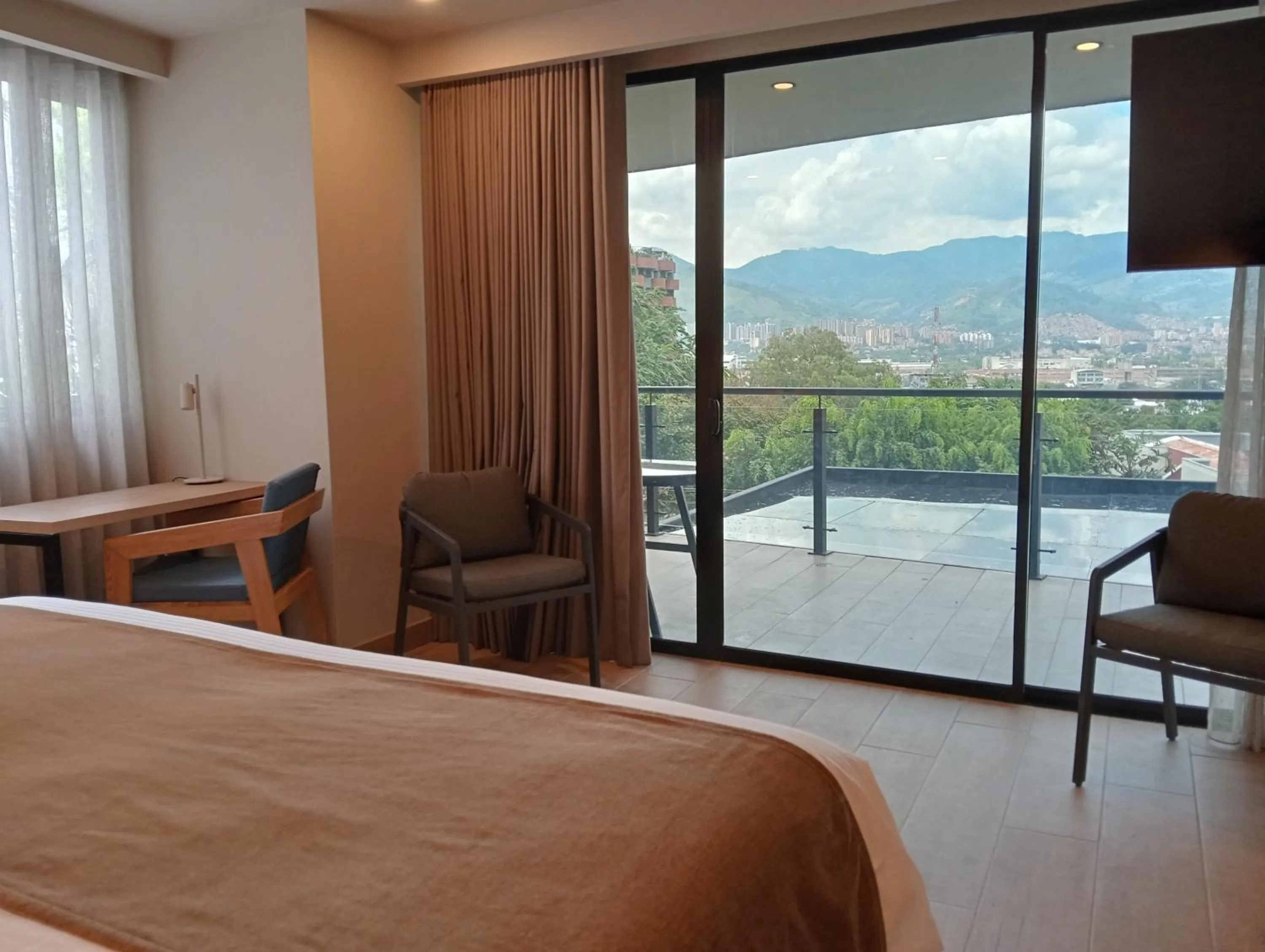 View (from property/room), Bed in Hotel Rulay Medellin
