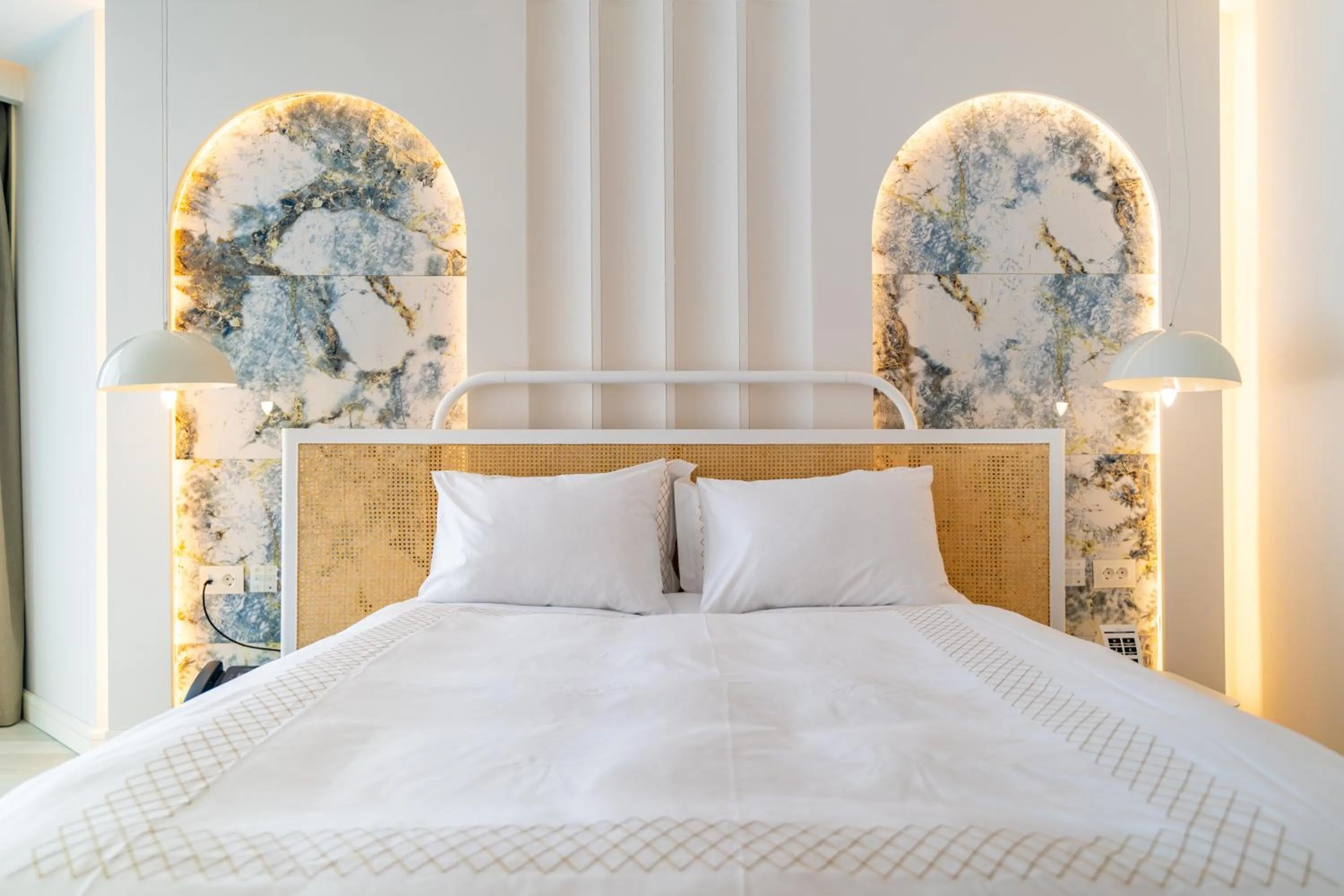 Bed in Qlusive Hotel