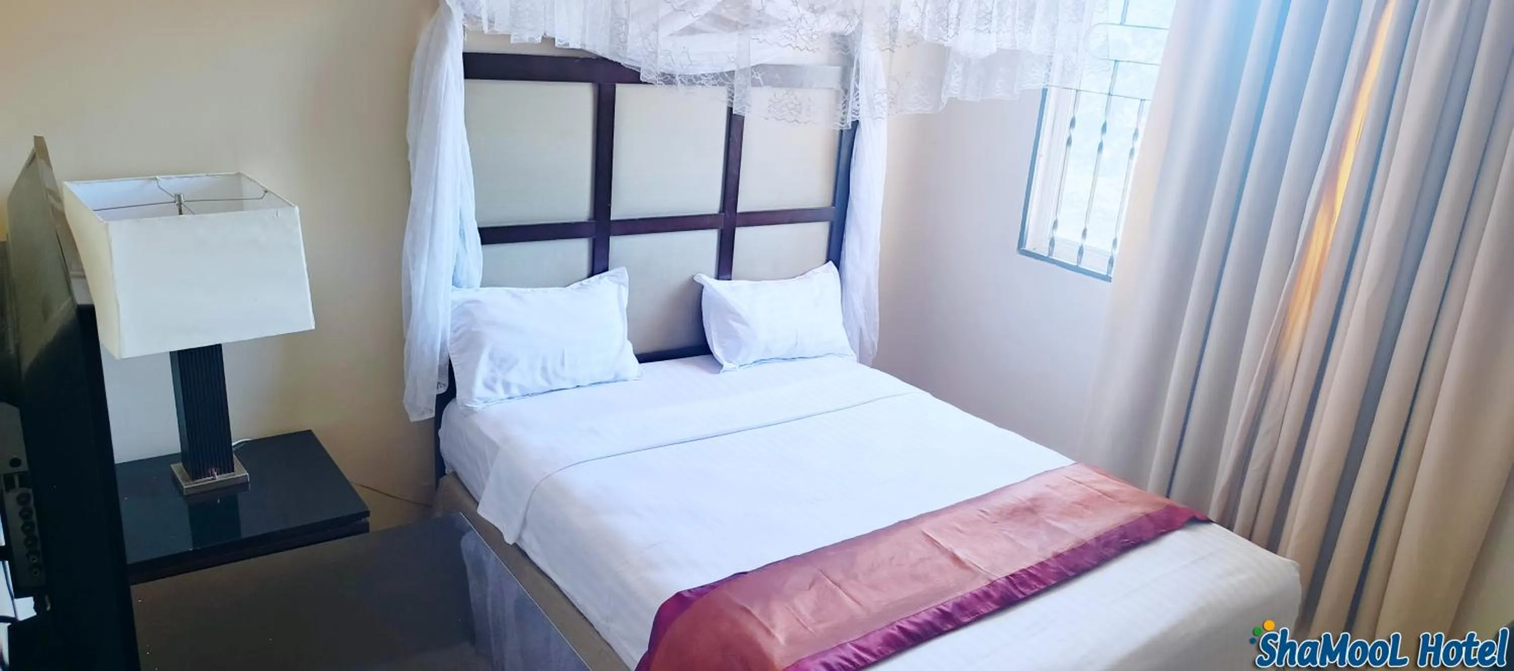 Bed in ShaMooL Hotel