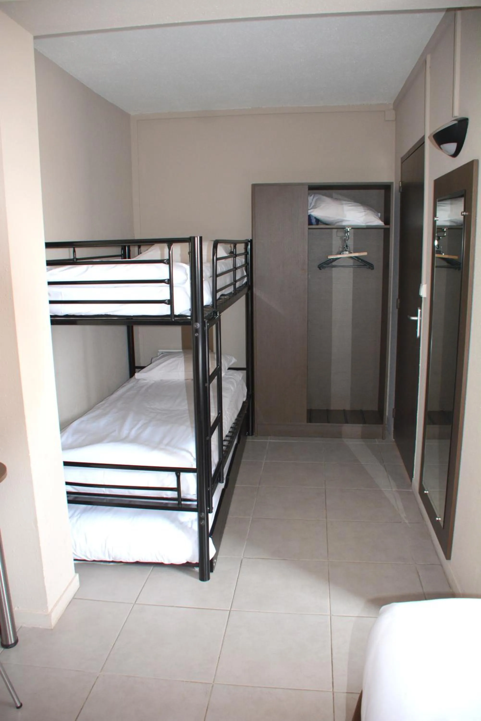 Bedroom in Hôtel Le Floreal