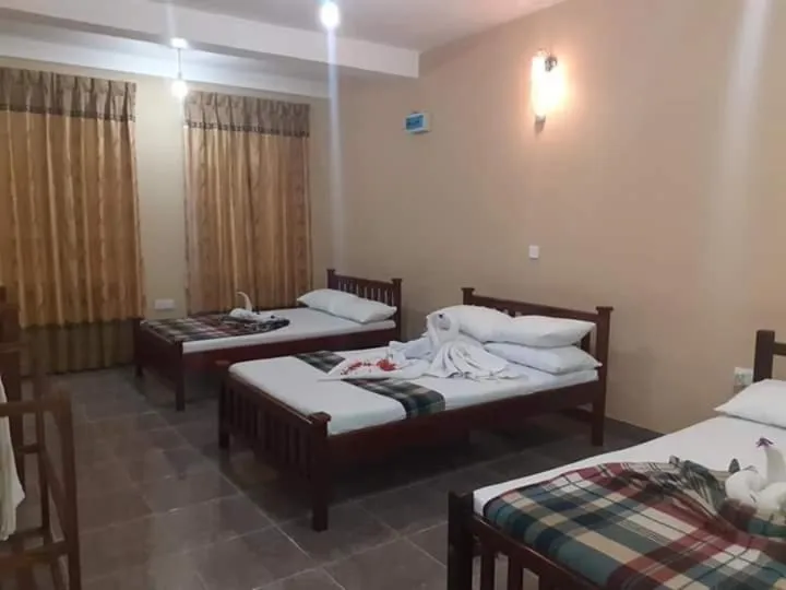 Bed in Anura Guest Inn