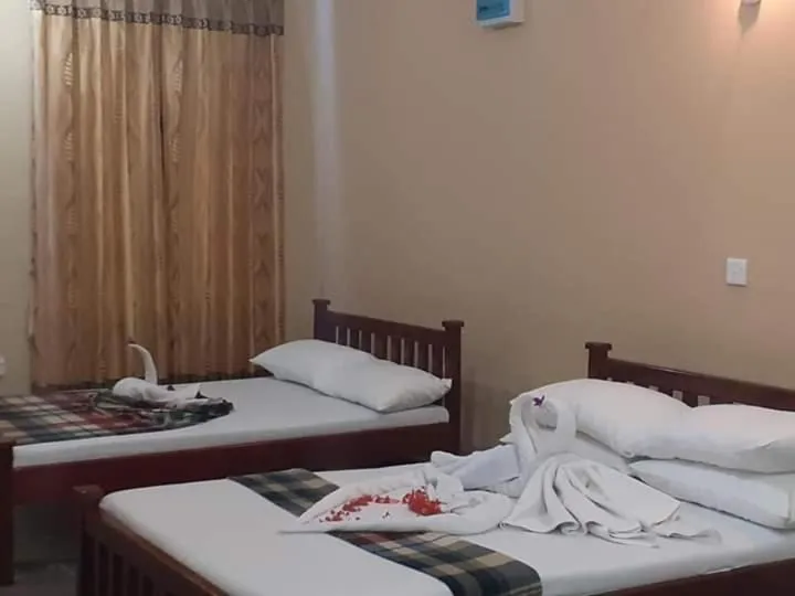 Bed in Anura Guest Inn