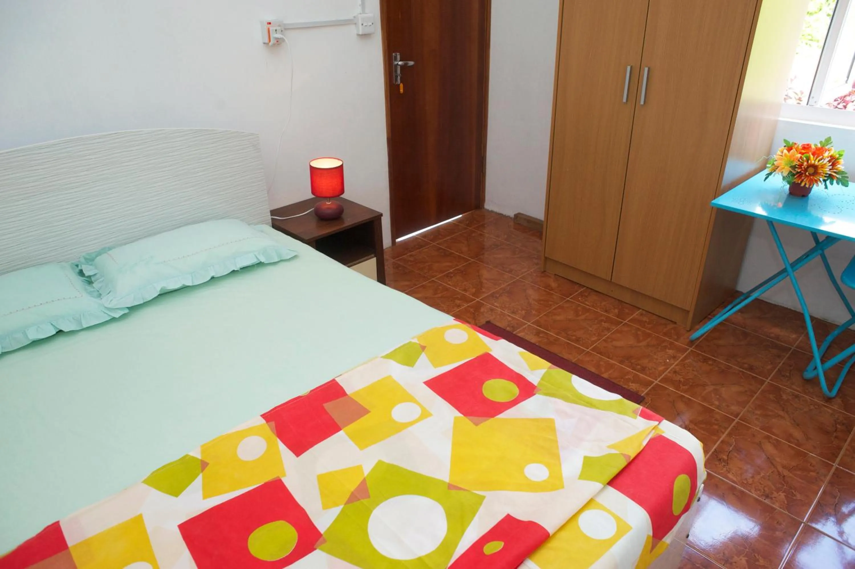 Bed in Chez Ronald Guest House