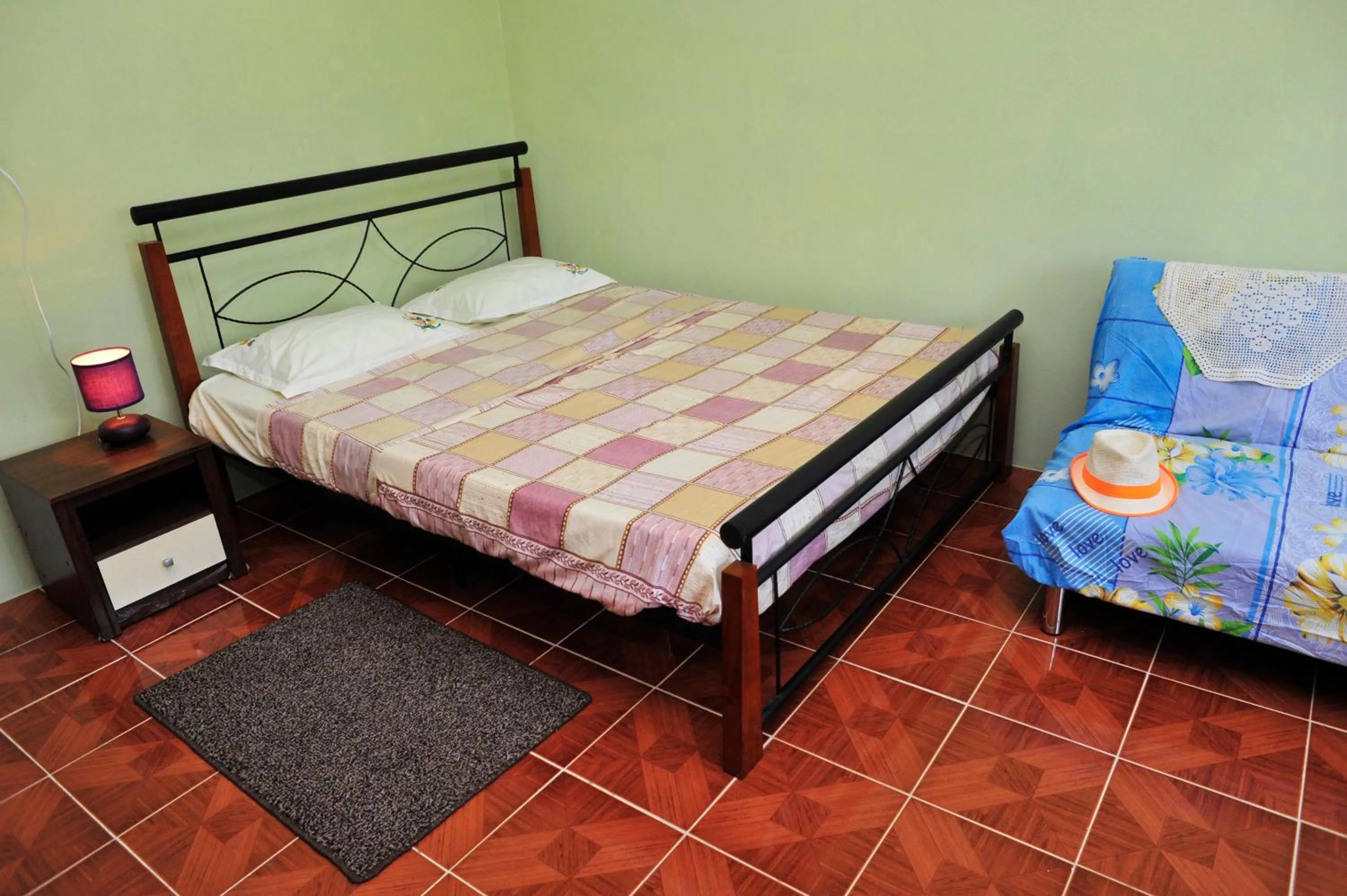 Bed in Chez Ronald Guest House