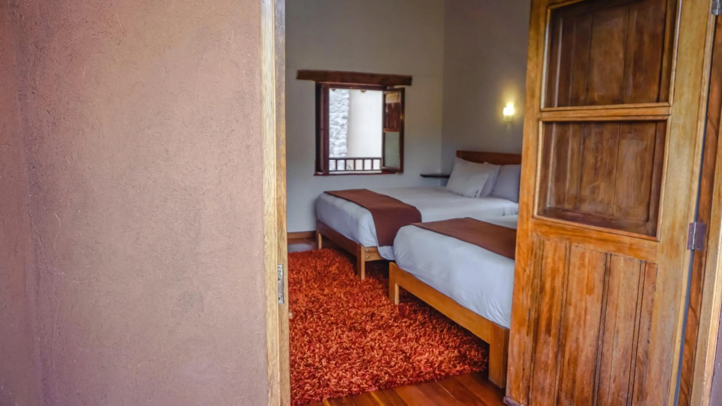 Photo of the whole room, Bed in Lizzy Wasi Urubamba