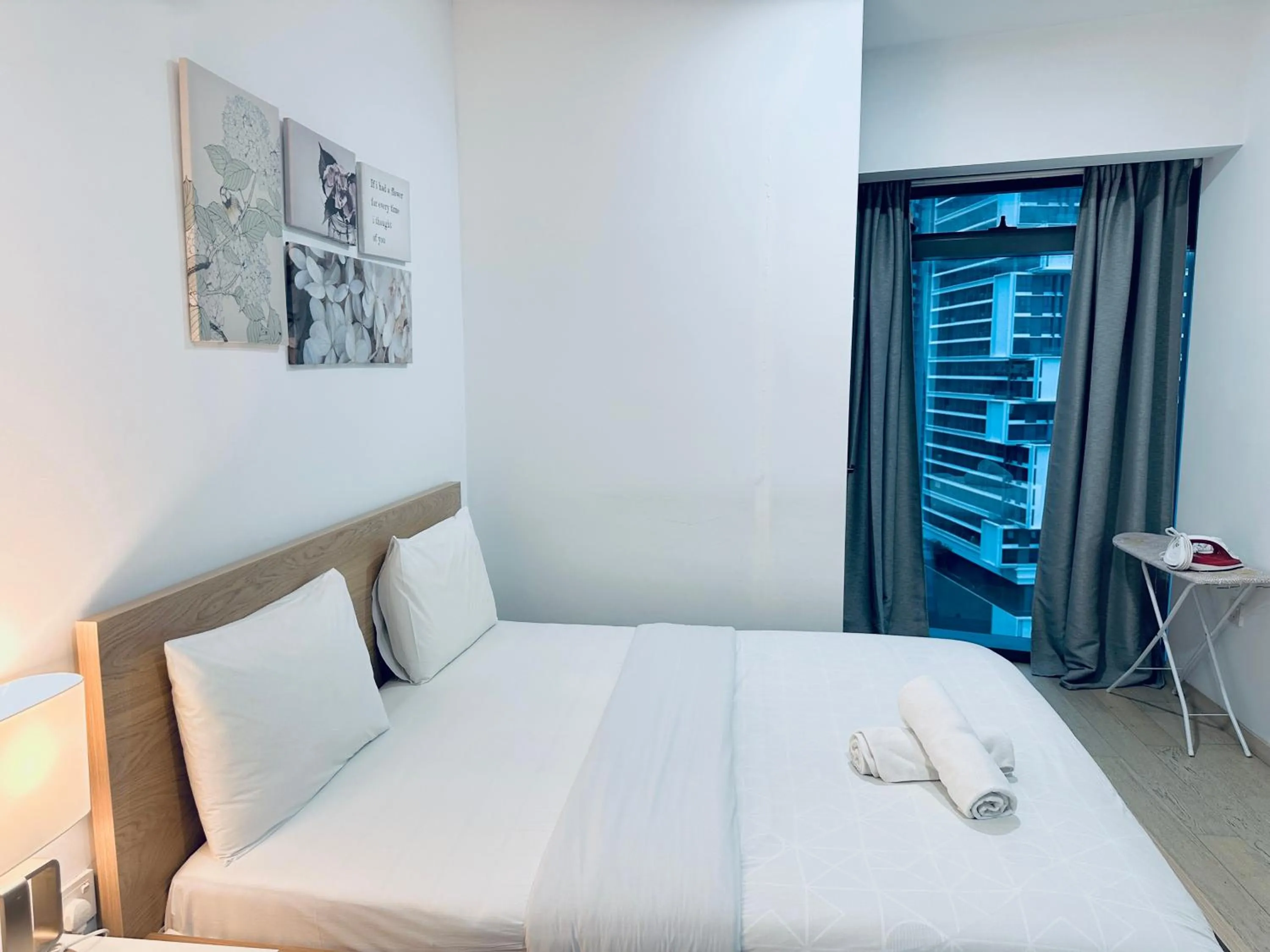 Photo of the whole room, Bed in Eaton Residences By Luna