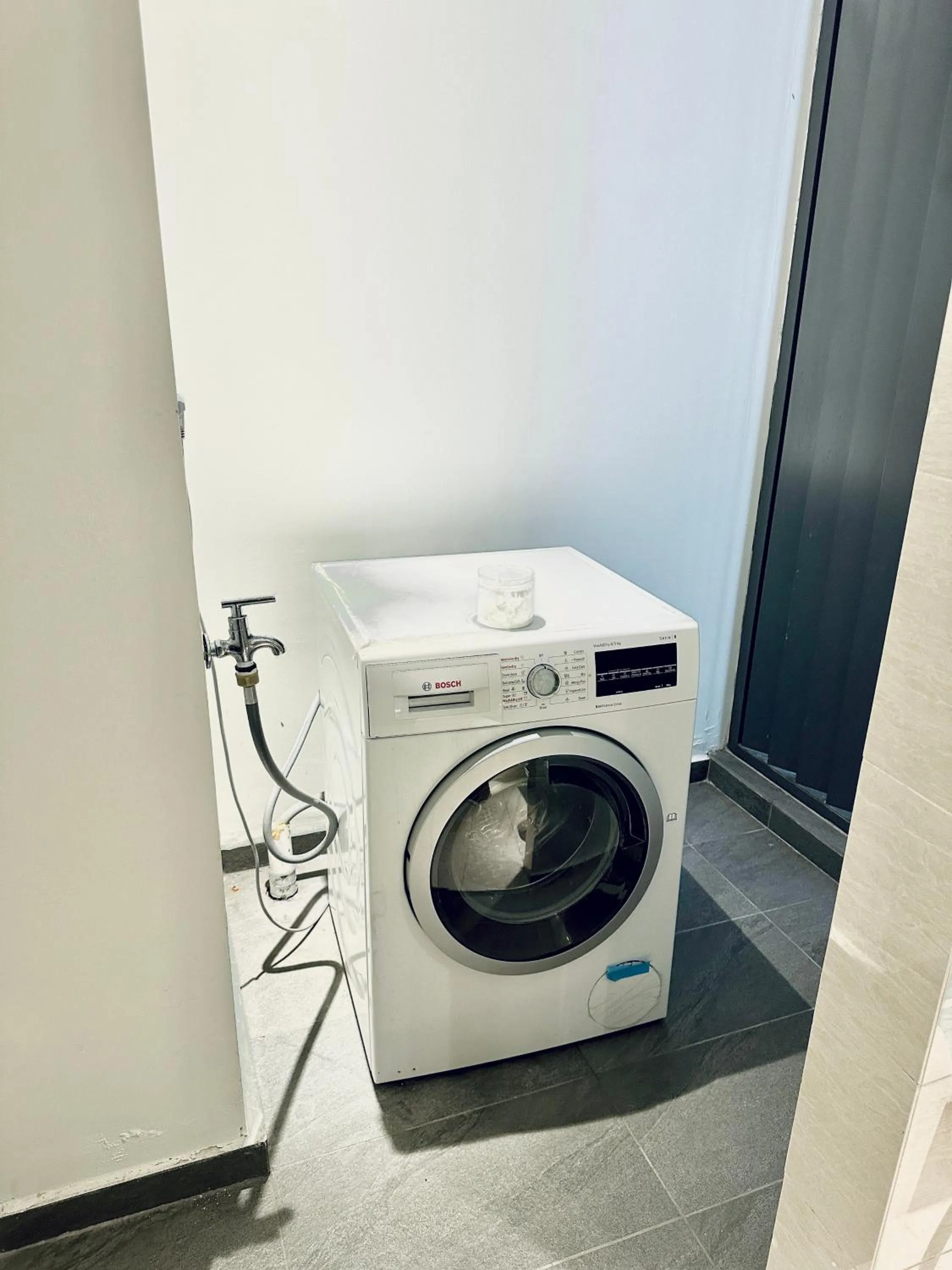 washing machine in Eaton Residences By Luna