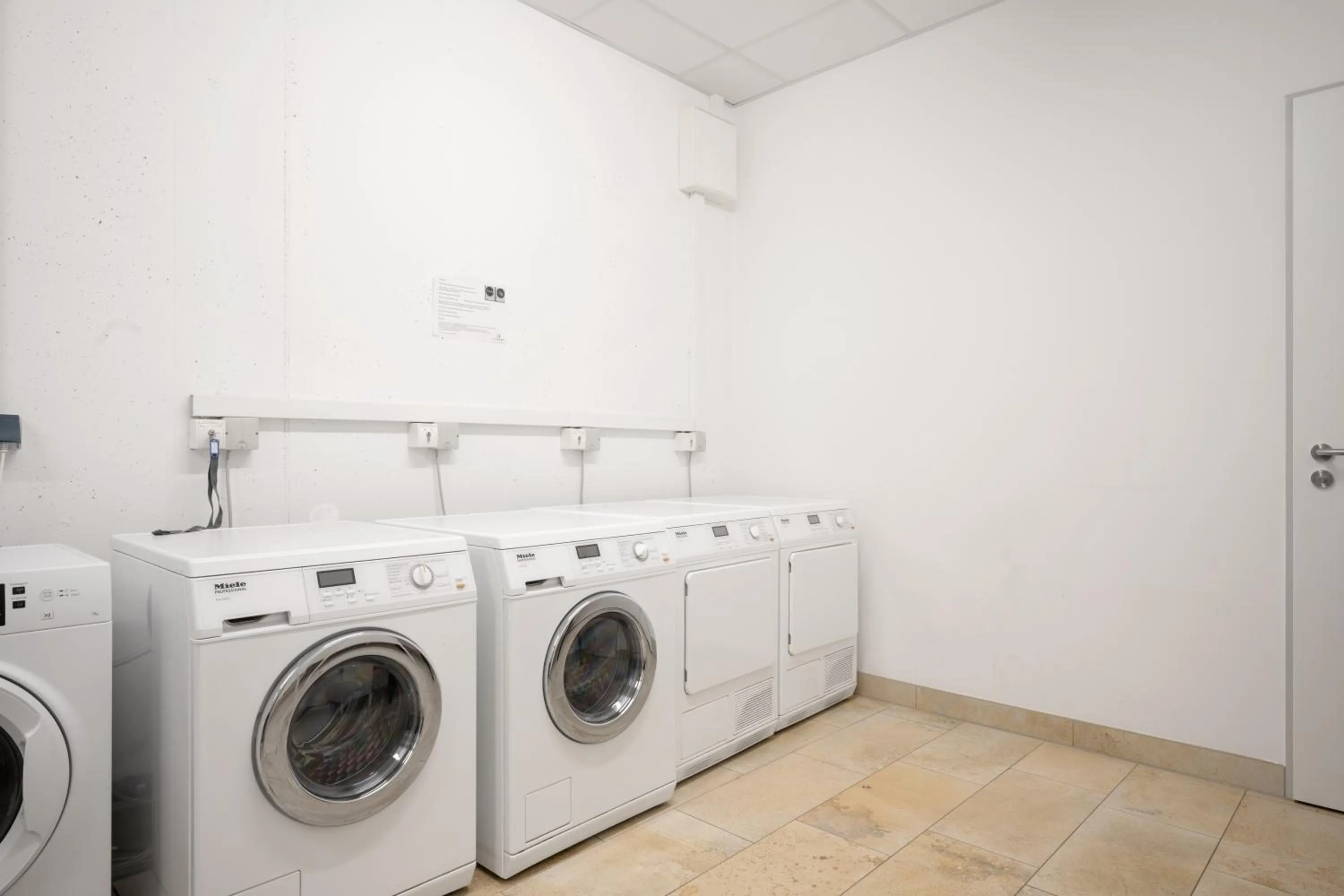 washing machine in Snooze Apartments