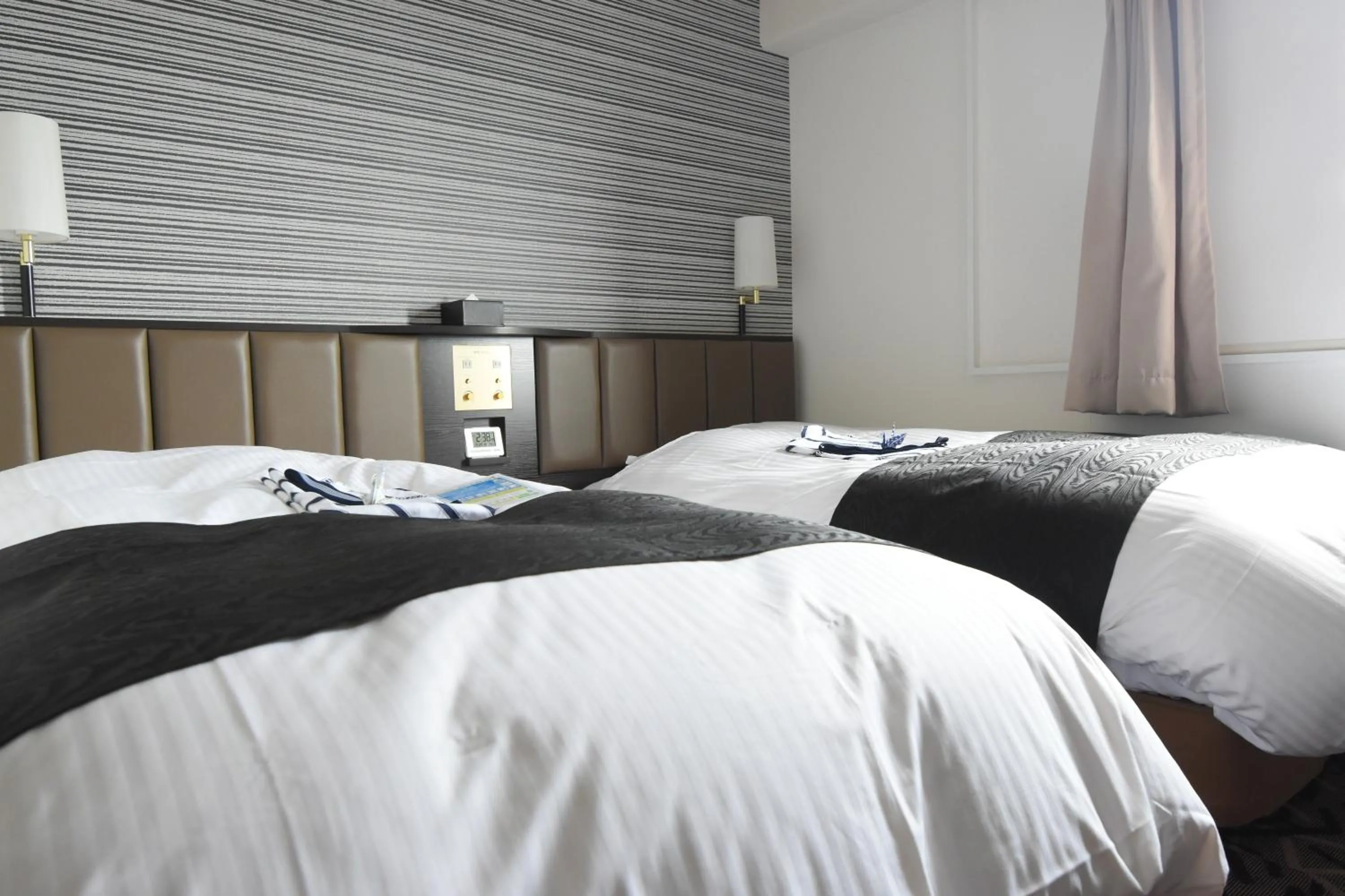 Bed in APA Hotel Miyazaki Miyakonojo Ekimae