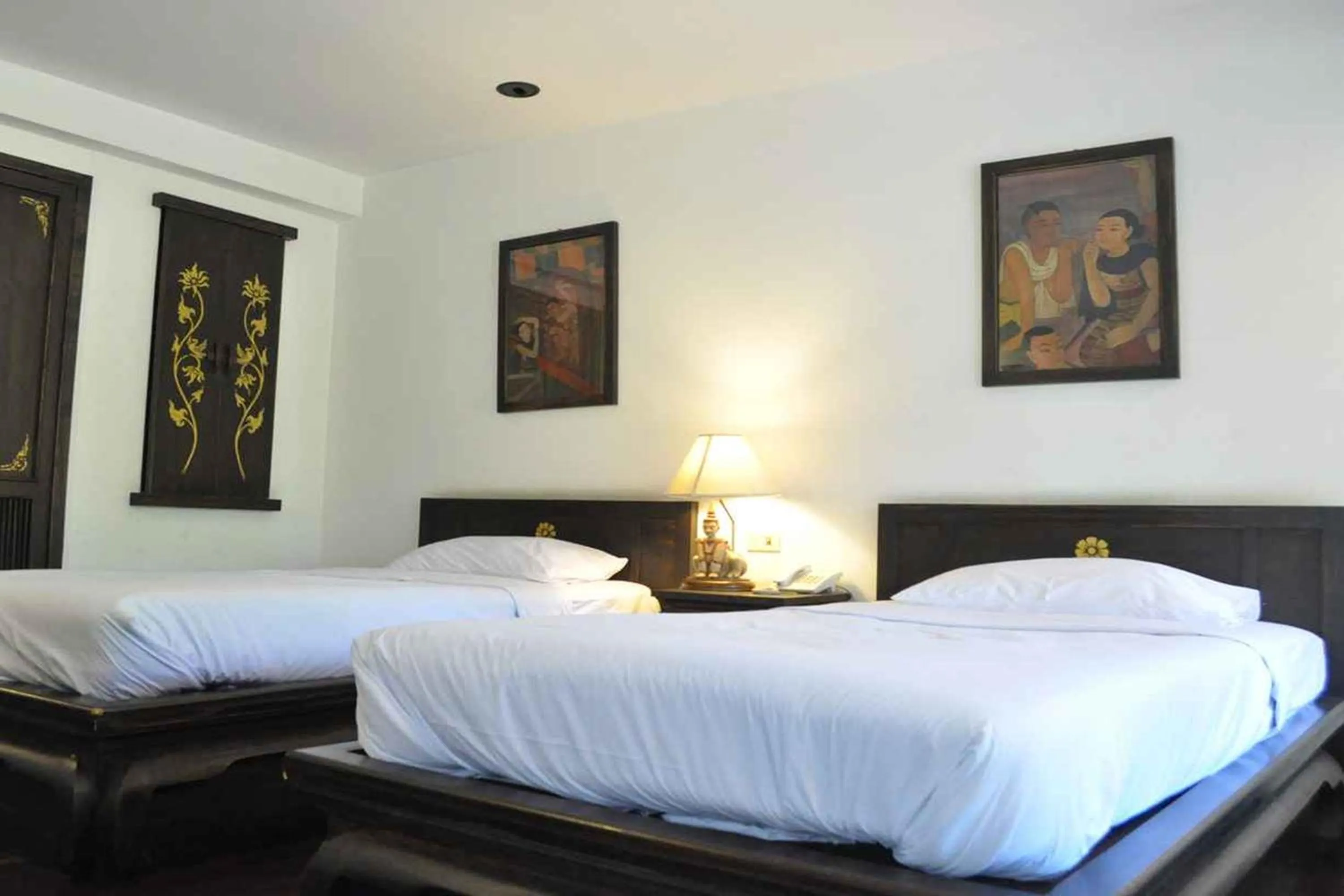 Bed in Baan Orawee Boutique Hotel