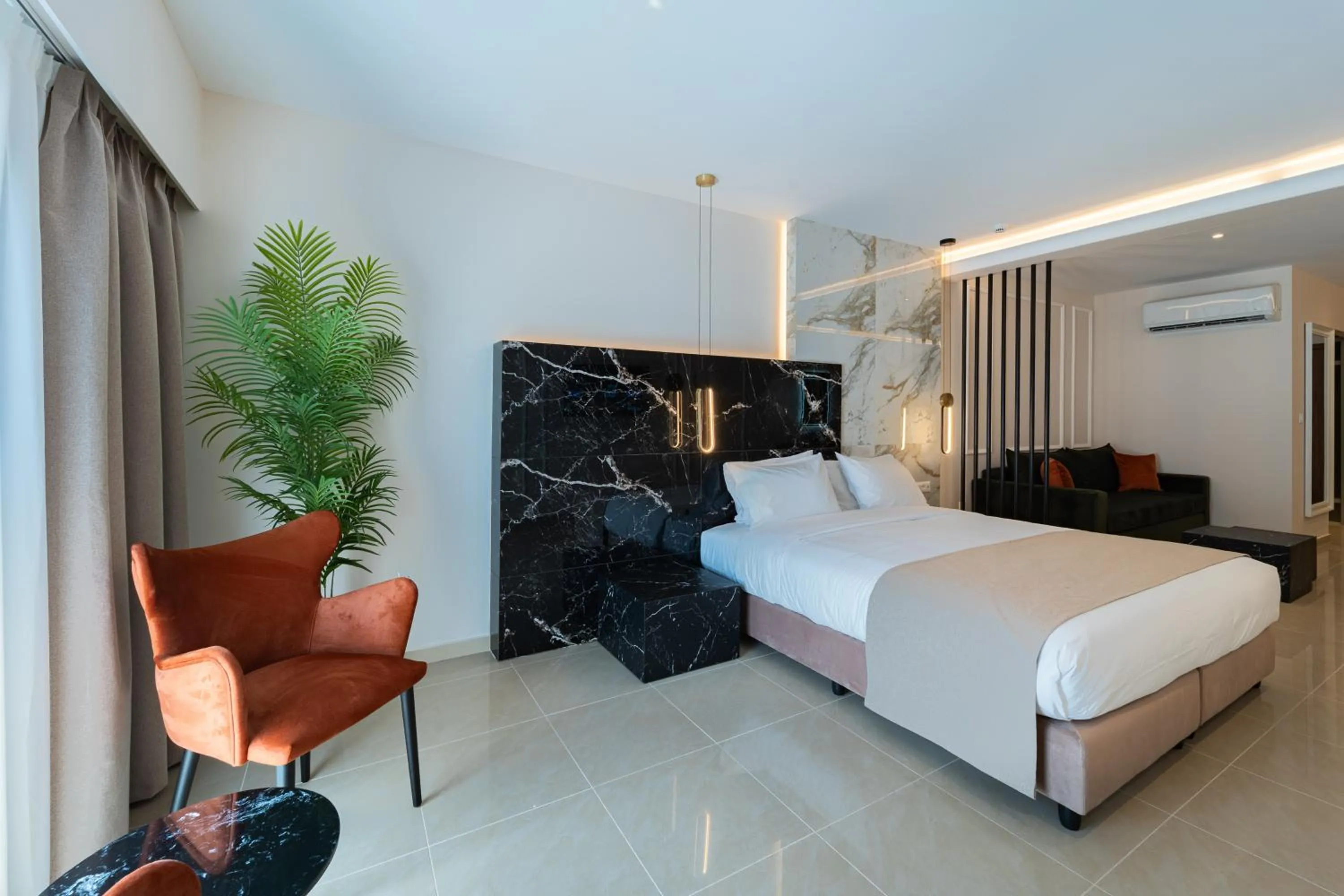 Bed in Philia Center Suites