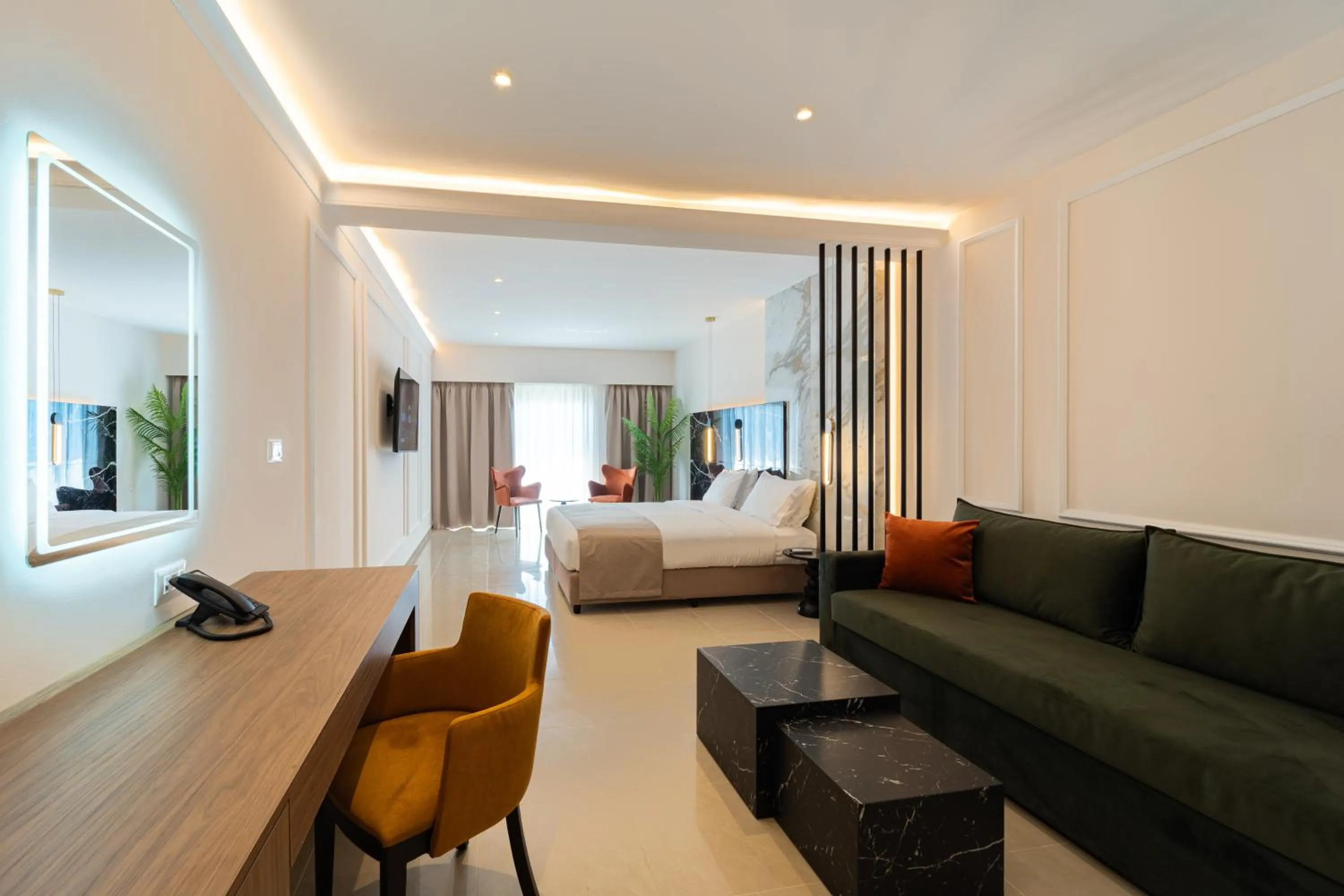 Living room, Bed in Philia Center Suites