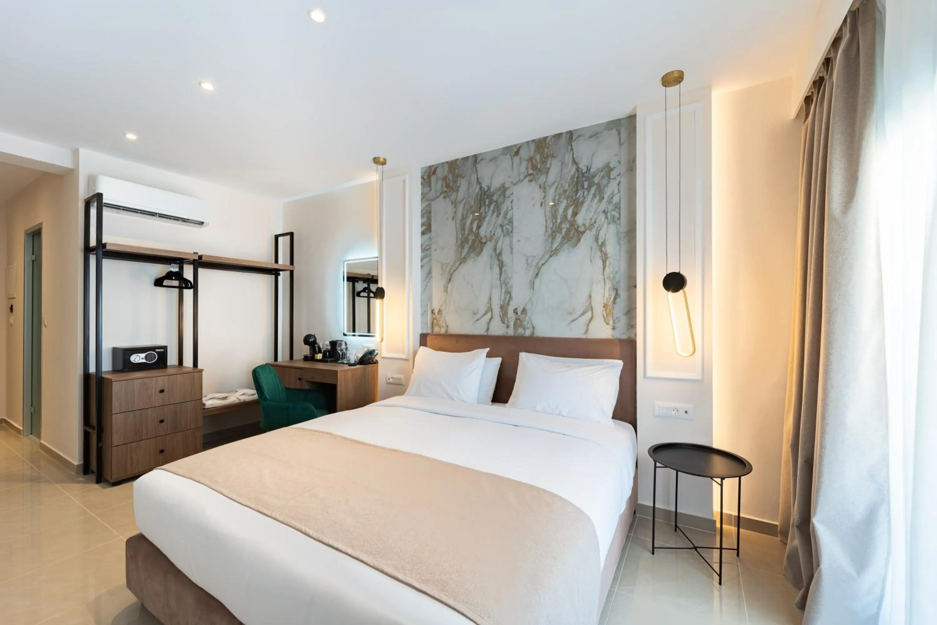 Bed in Philia Center Suites