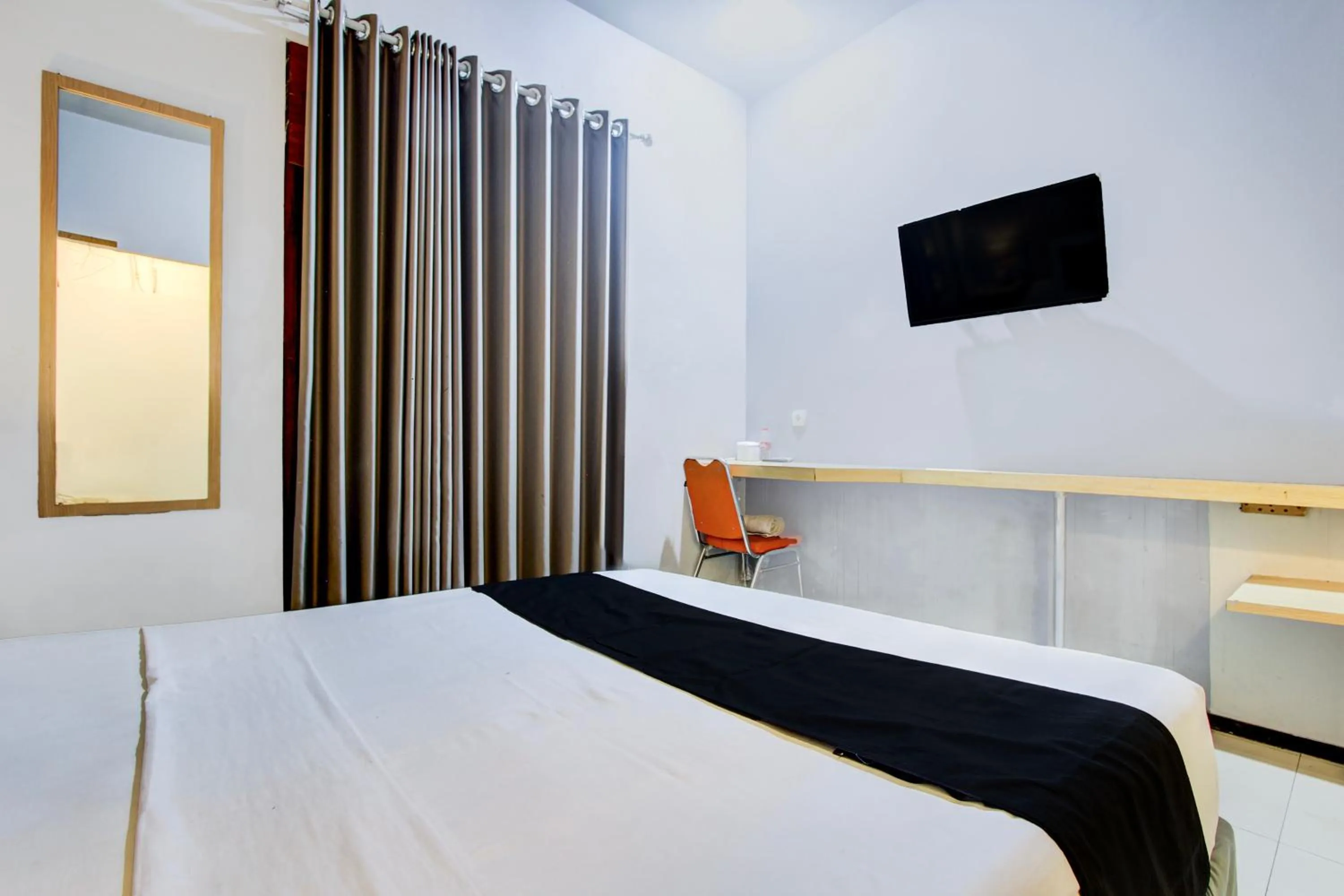 Photo of the whole room, Bed in Hotel O Tegal near near Pacific Mall Tegal formerly Hugo Suites Family