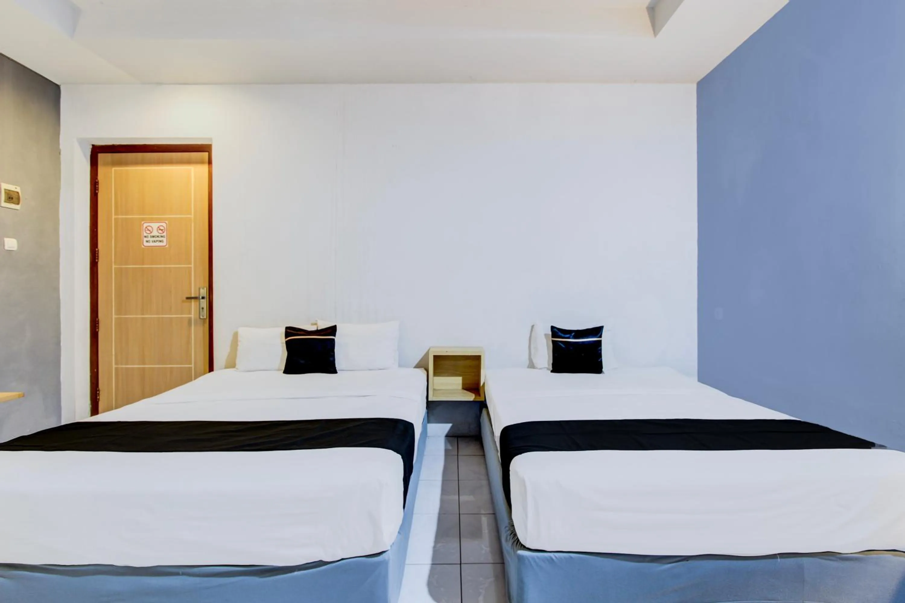 Photo of the whole room, Bed in Hotel O Tegal near near Pacific Mall Tegal formerly Hugo Suites Family