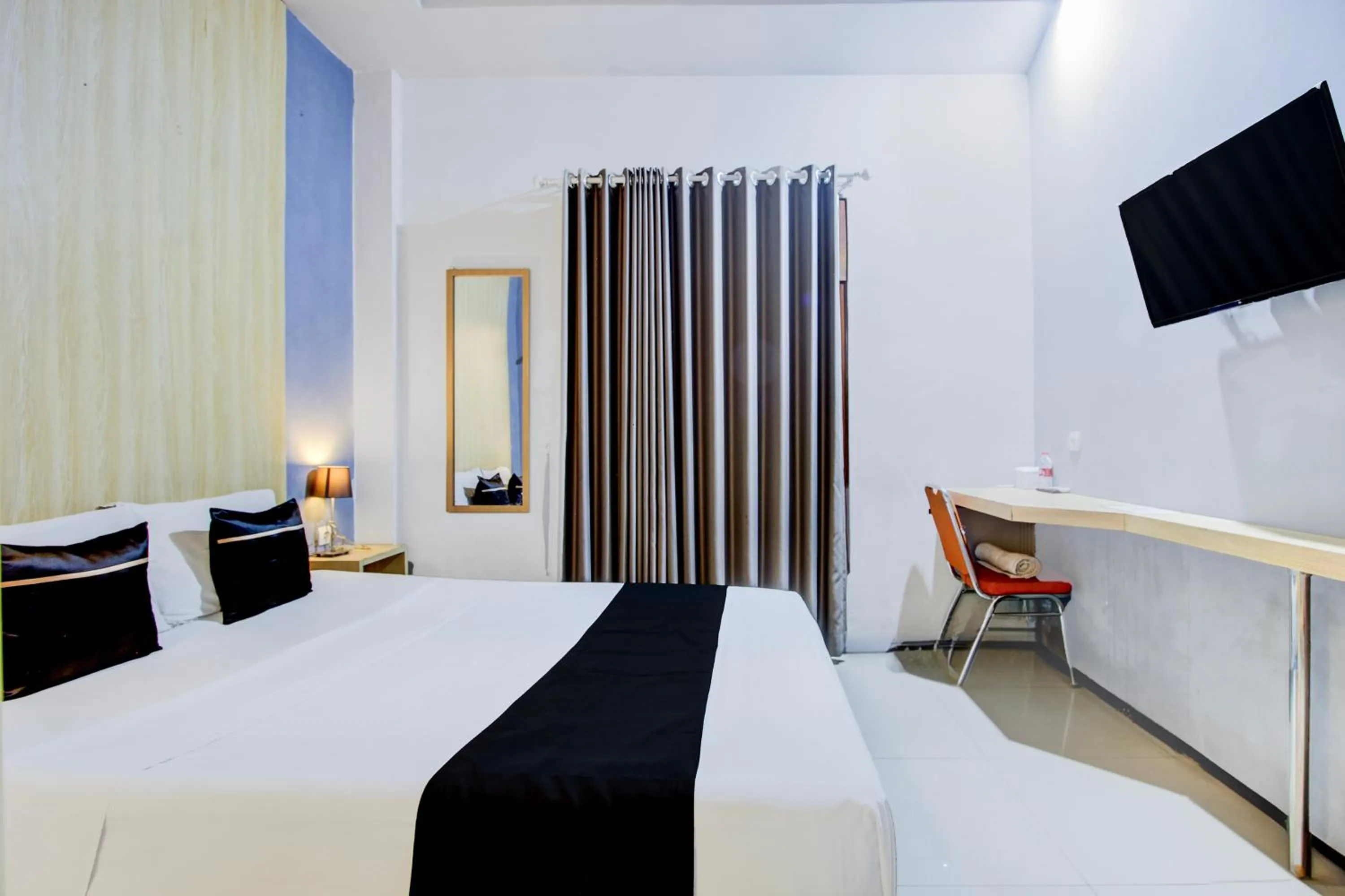 Photo of the whole room, Bed in Hotel O Tegal near near Pacific Mall Tegal formerly Hugo Suites Family